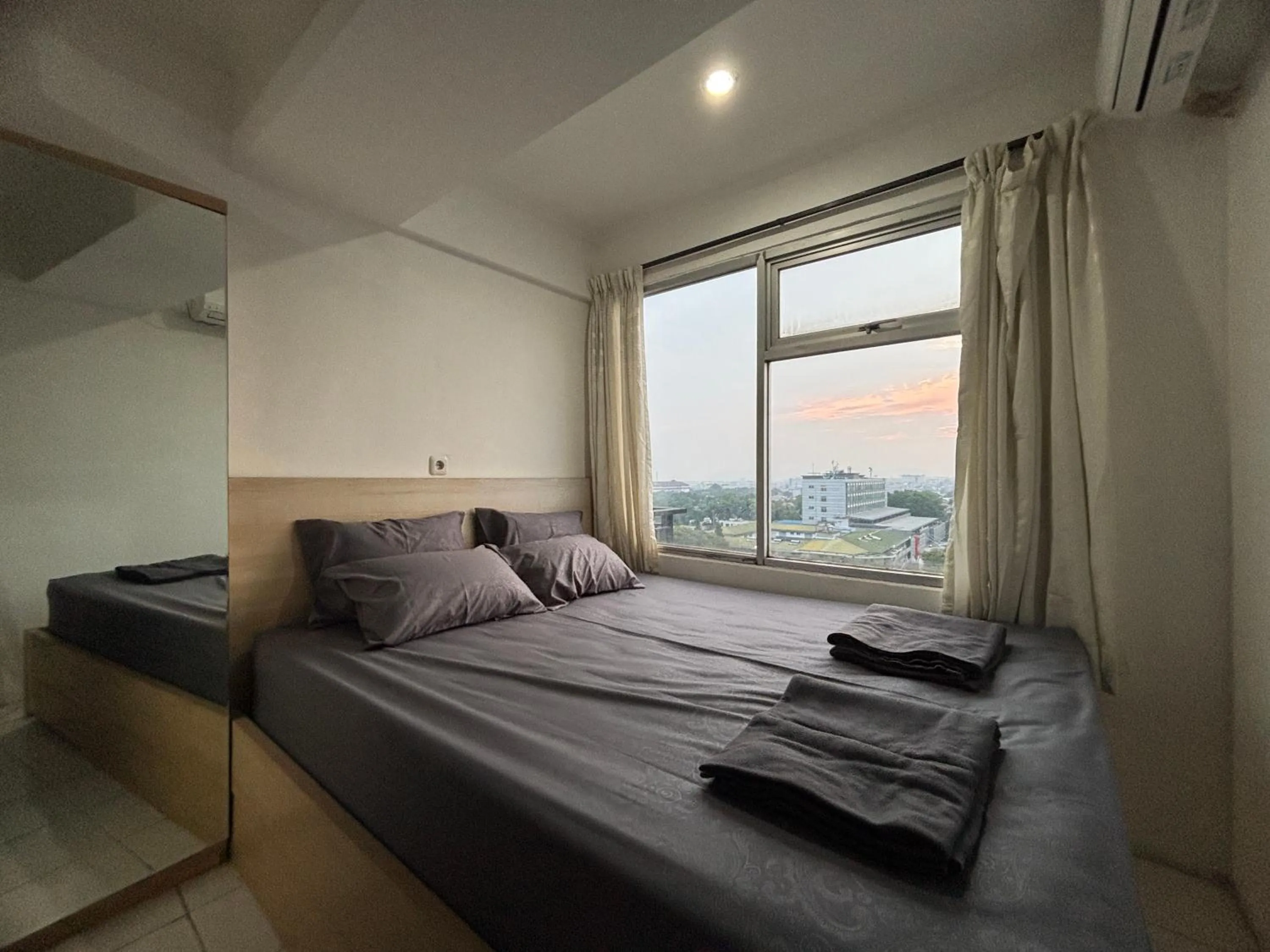 Bed in The Jarrdin Apartment Hotels by Ironman