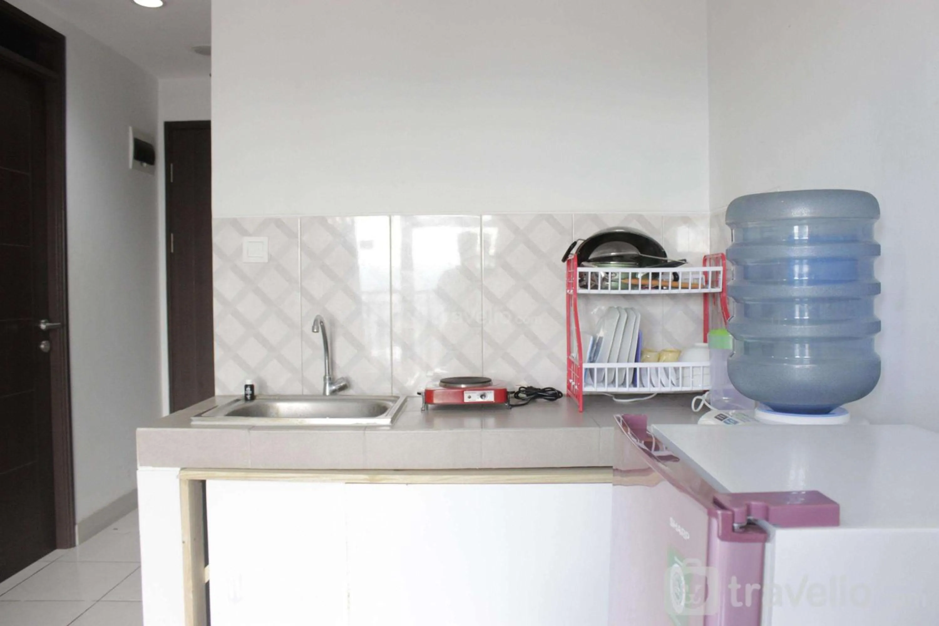 Bed in Comfy 2BR Apartment at Mekarwangi Square Cibaduyut By Travelio