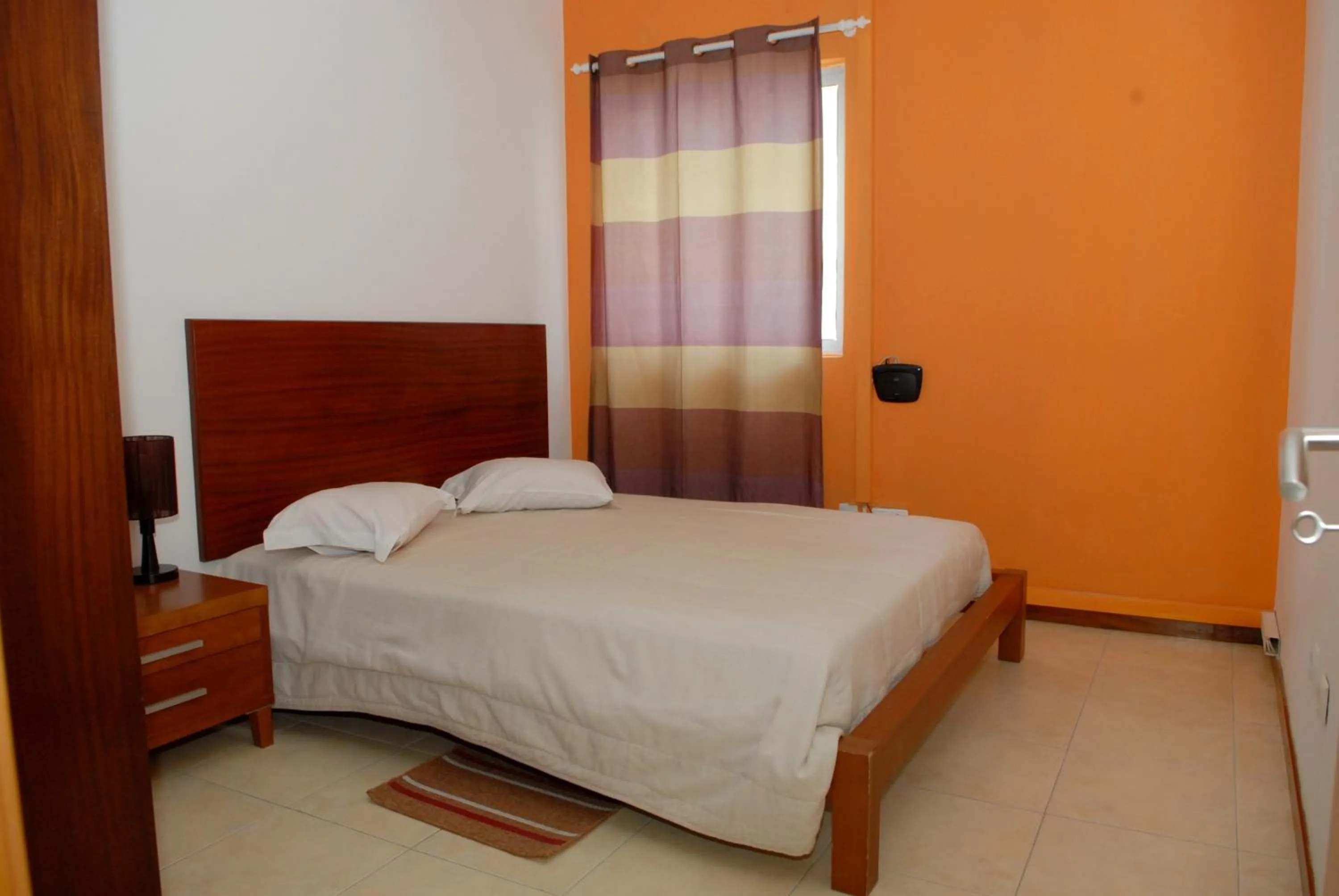 Photo of the whole room, Bed in Apartamentos Santiago - Praia
