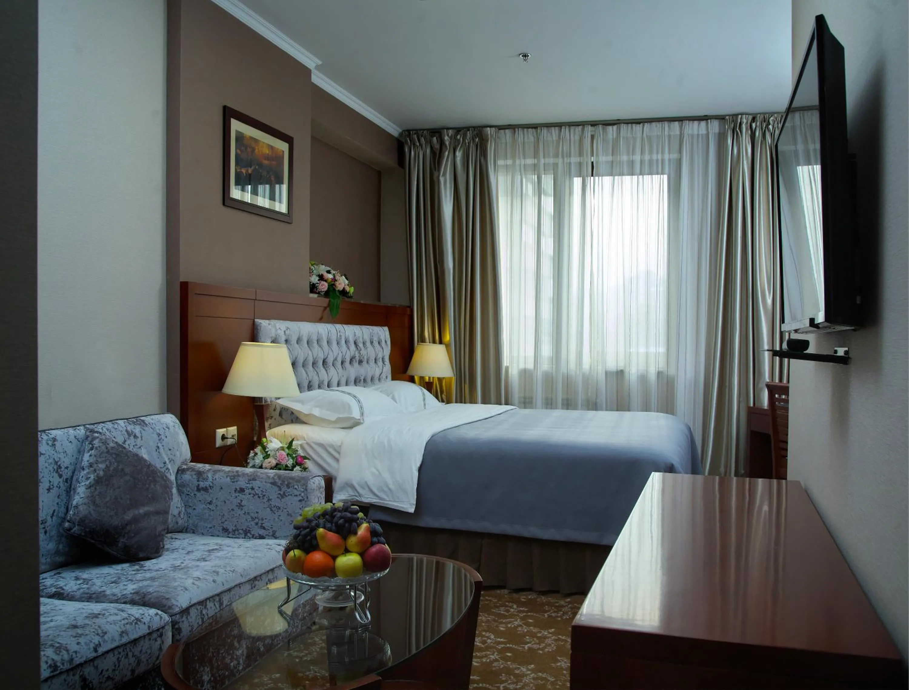 Living room, Bed in Grand Voyage Hotel