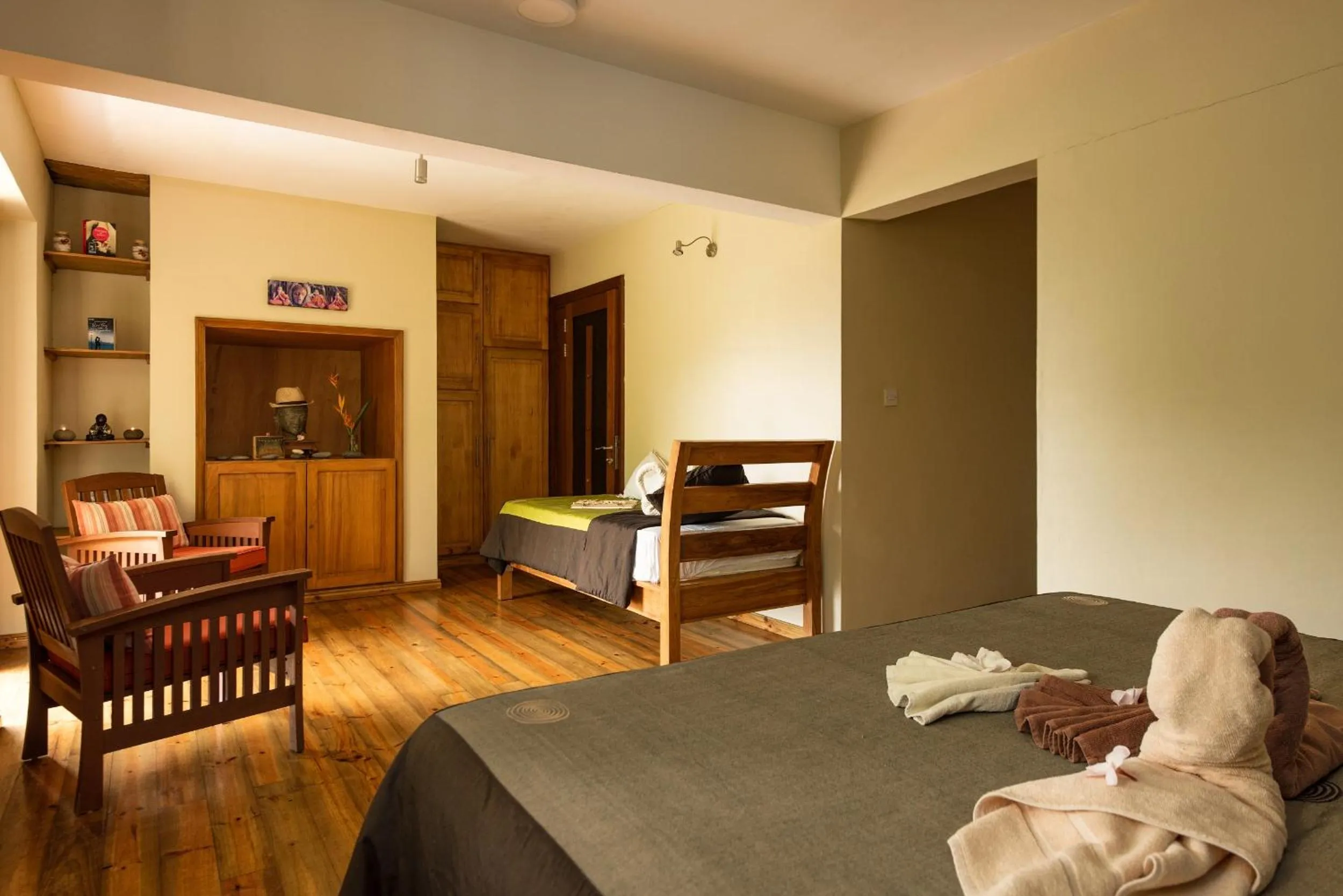 Seating area, Bed in Happy Days Guest House
