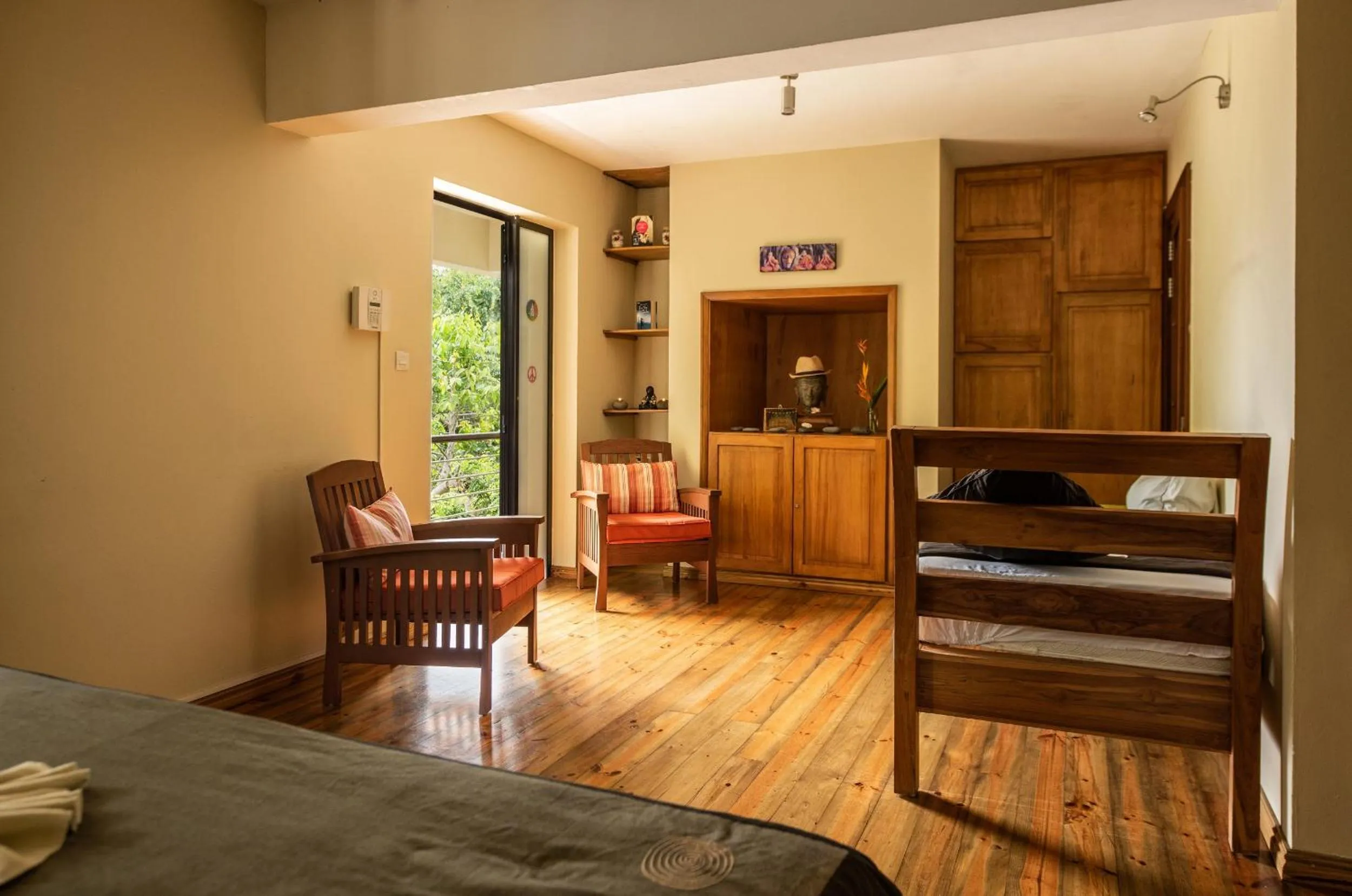 Seating area, Bed in Happy Days Guest House