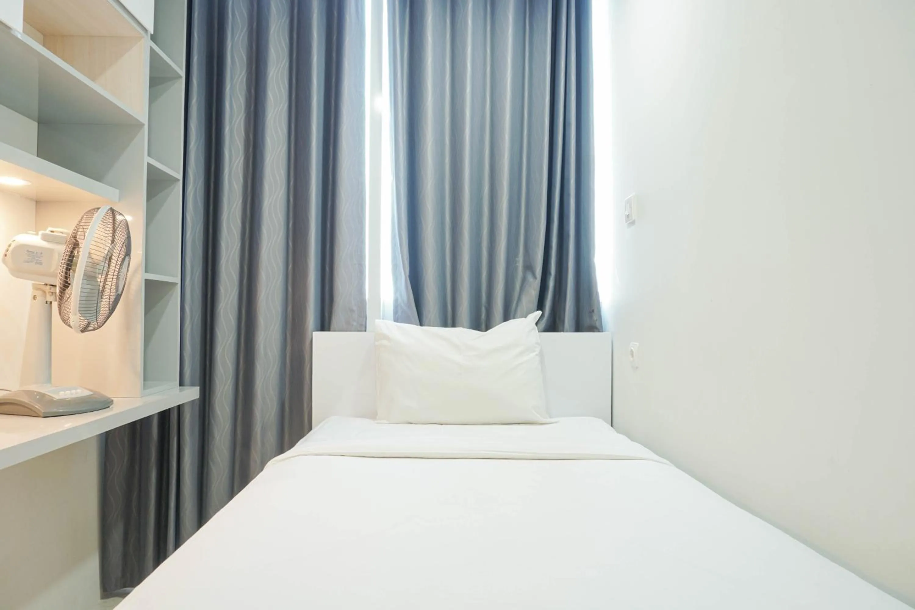 Bed in Fully Furnished with Comfortable Design 2BR Harco Mangga Besar Apartment By Travelio