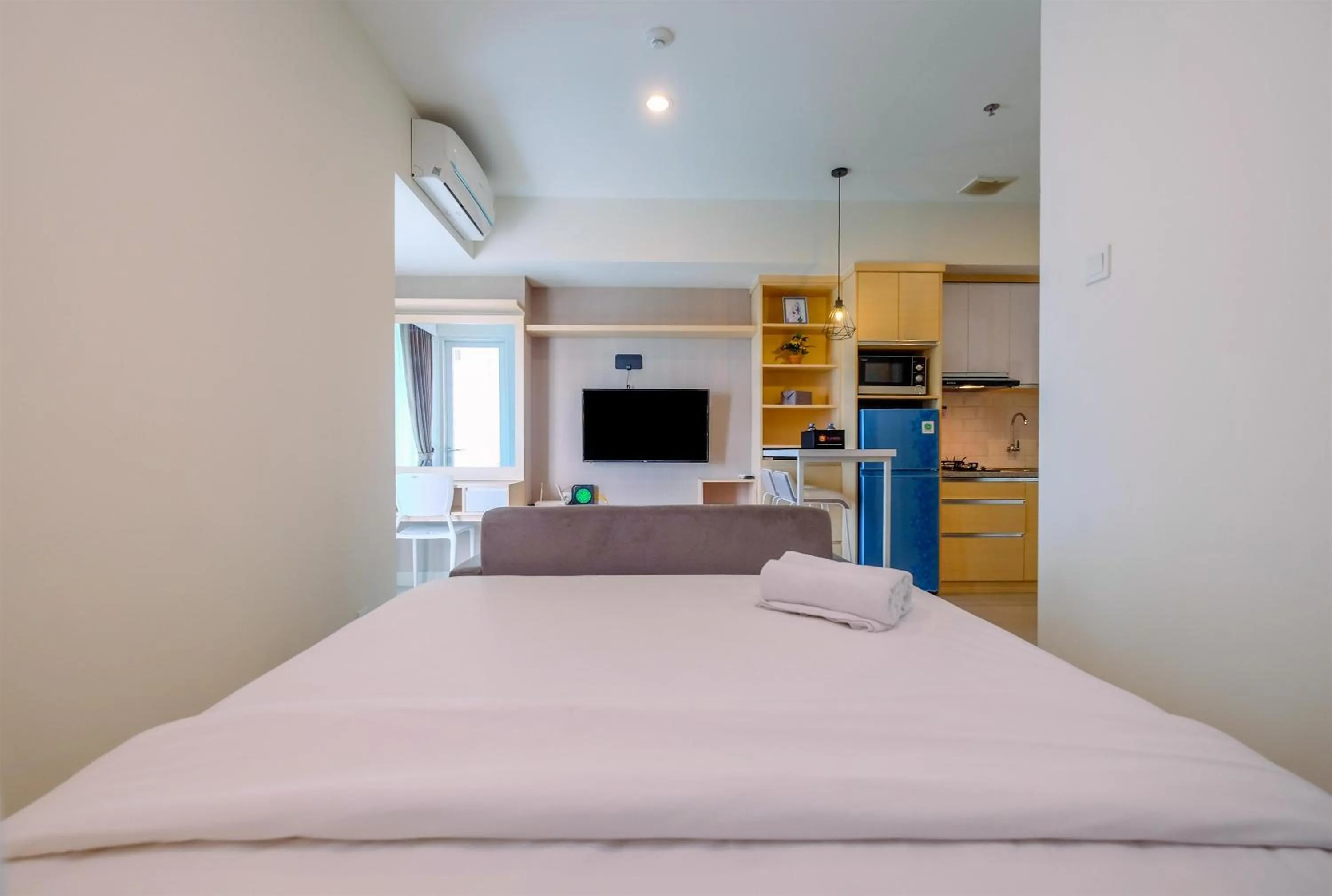 Cozy and Great Choice Studio at Grand Kamala Lagoon Apartment By Travelio