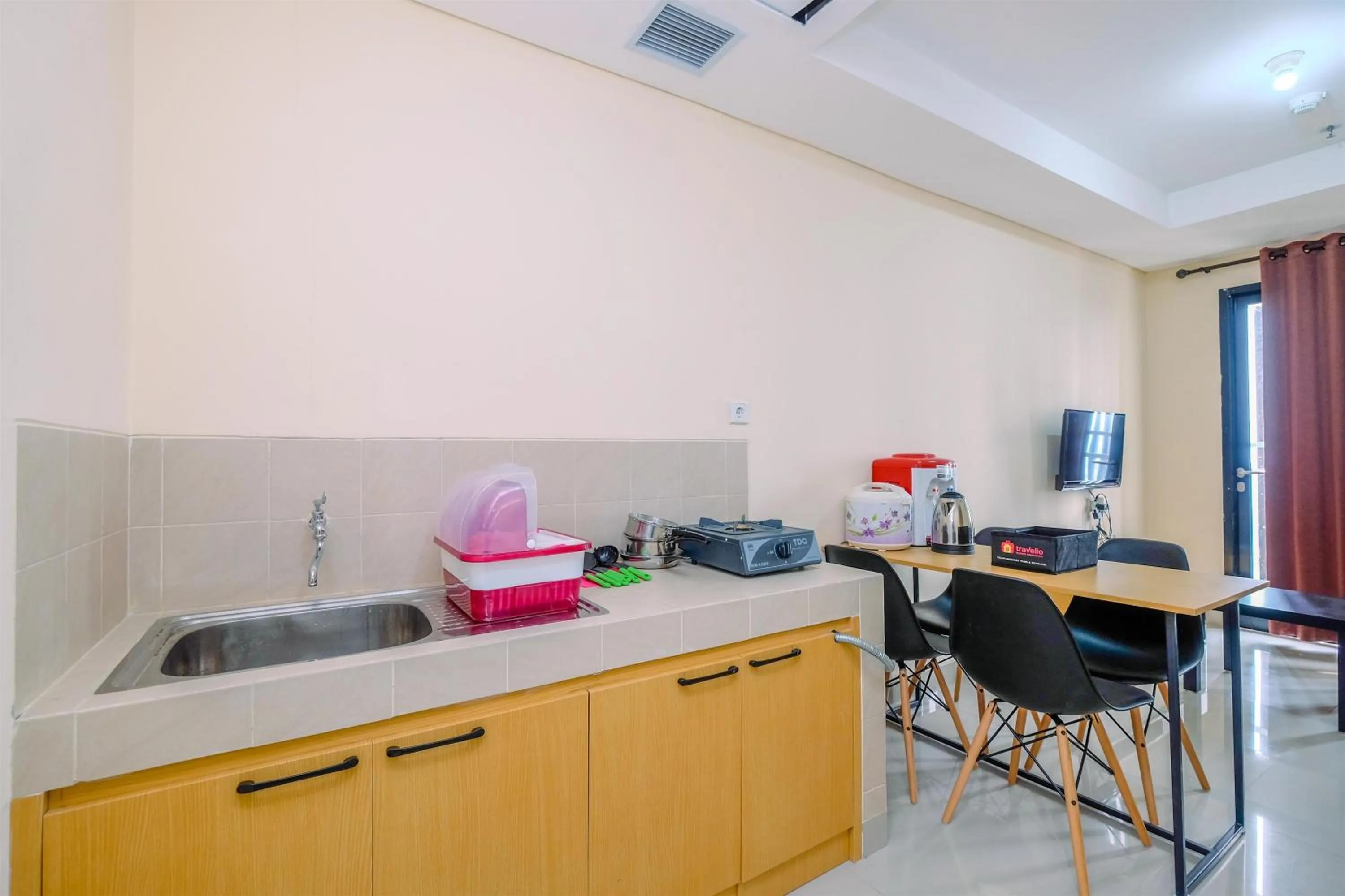 Kitchen or kitchenette in 2BR Best Rate Kebayoran Icon Apartment near Gandaria City By Travelio