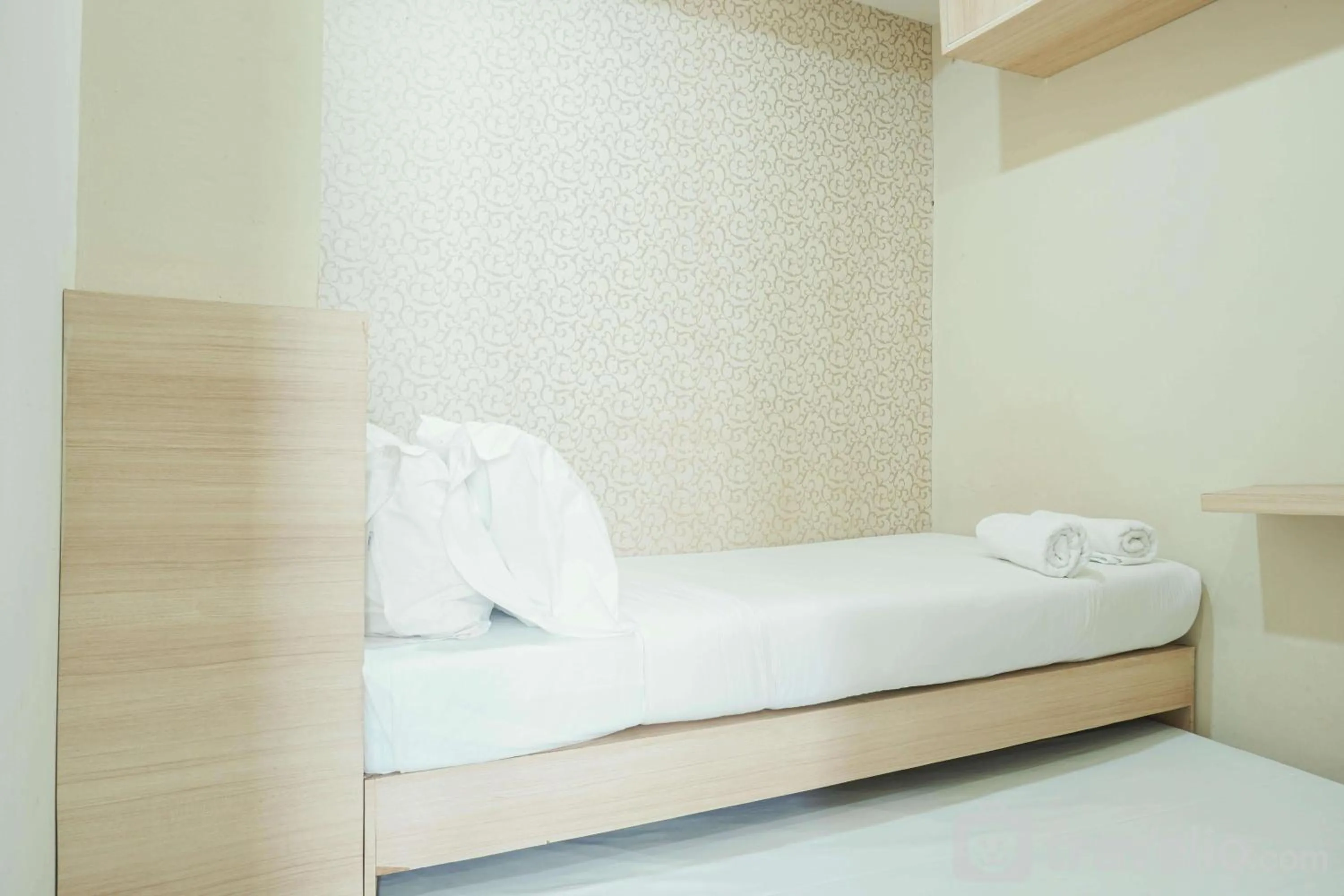 Bed in Comfy and Strategic 2BR at Menteng Square Apartment By Travelio