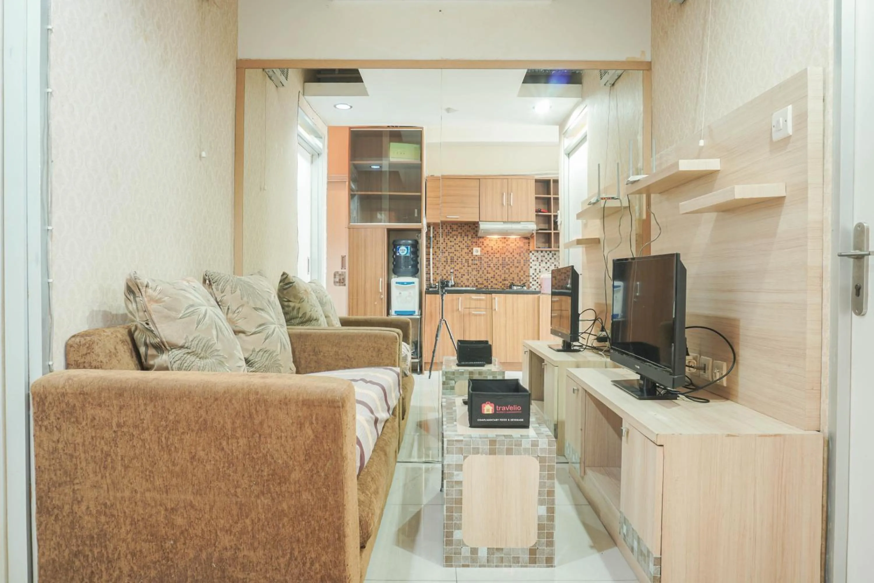 Living room in Comfy and Strategic 2BR at Menteng Square Apartment By Travelio