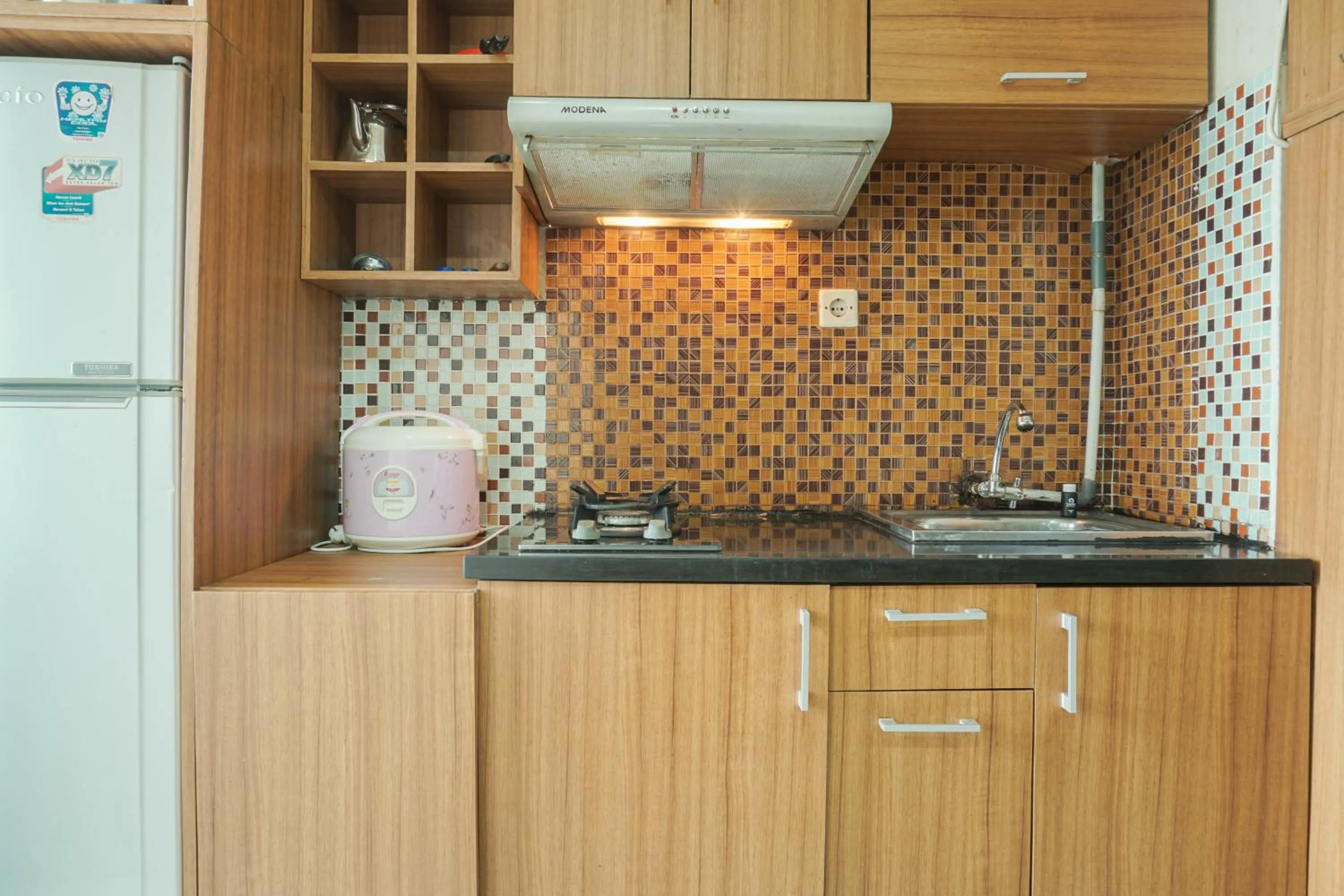 Kitchen or kitchenette in Comfy and Strategic 2BR at Menteng Square Apartment By Travelio