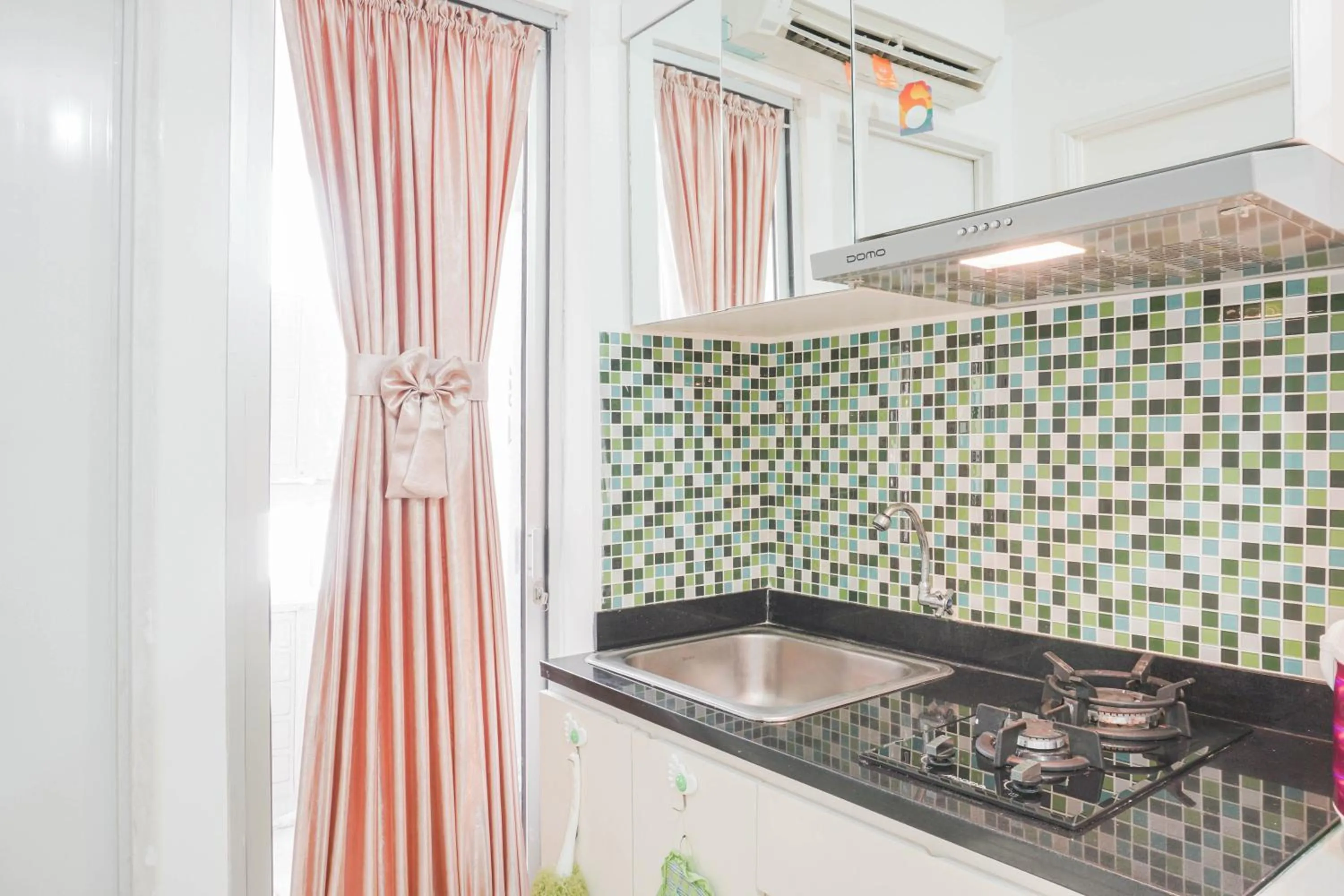 Elegant 2BR at Bassura City Apartment By Travelio