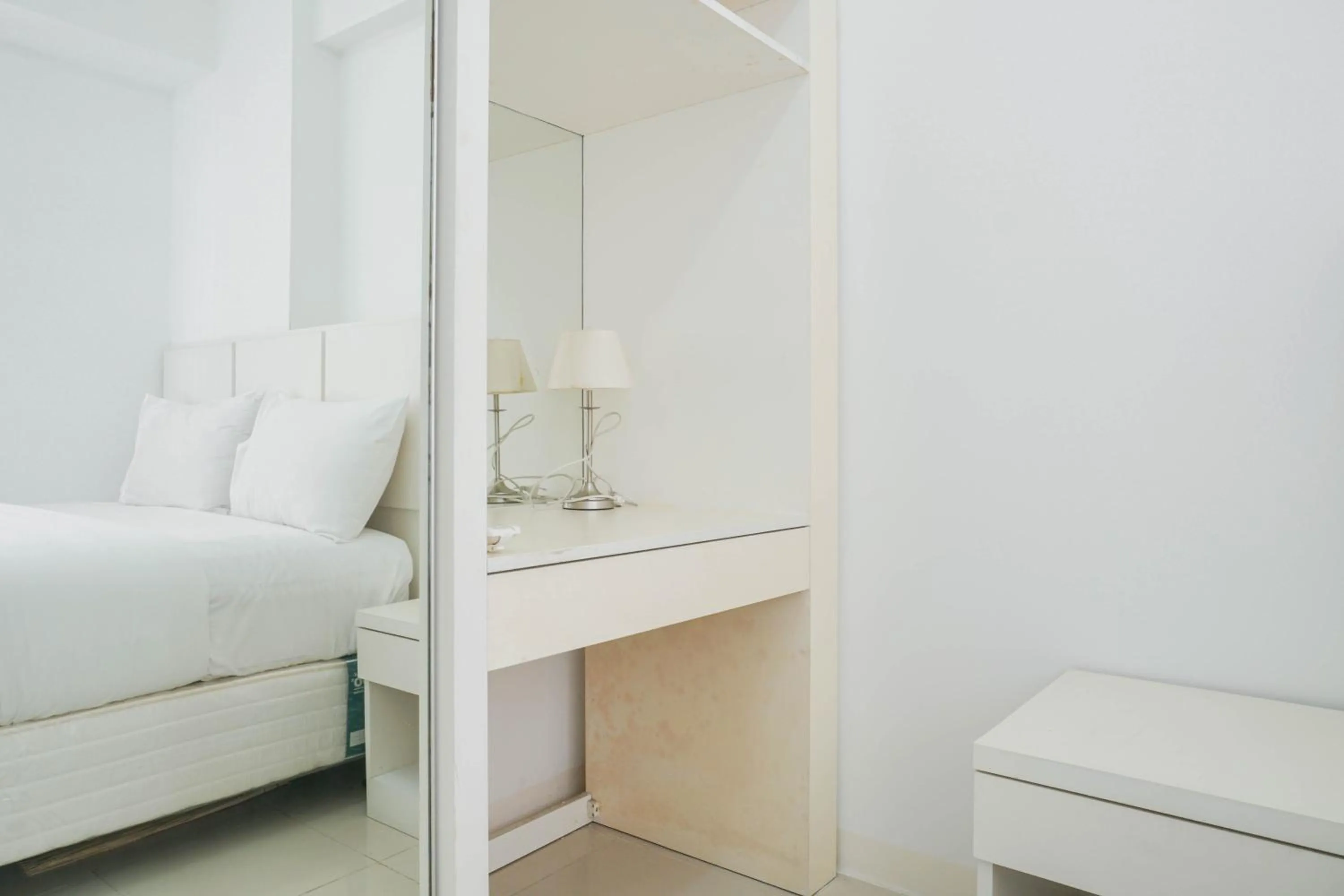 Bed in Elegant 2BR at Bassura City Apartment By Travelio