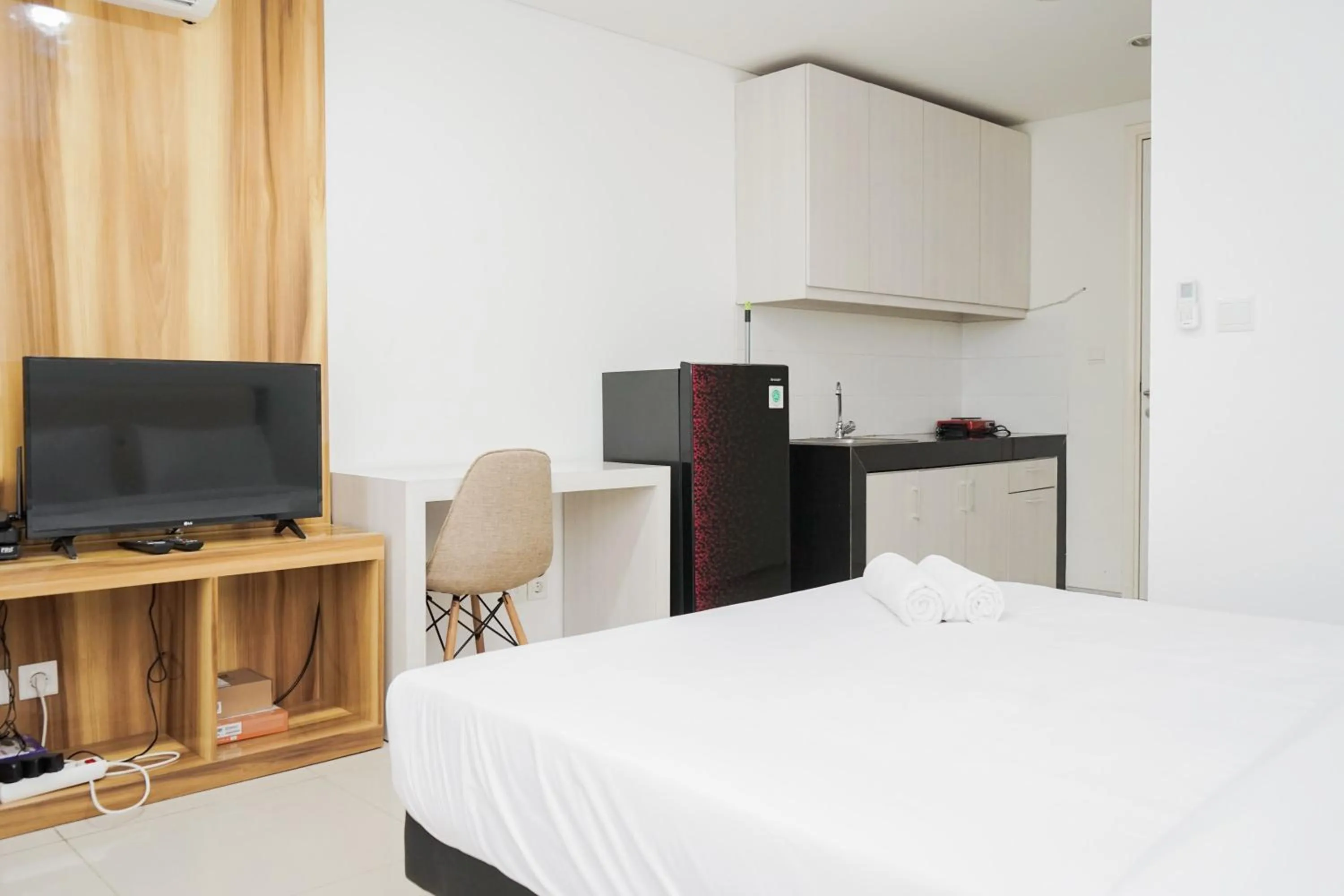 Bed in Functional Studio Apartment at Tuscany Residences BSD City By Travelio