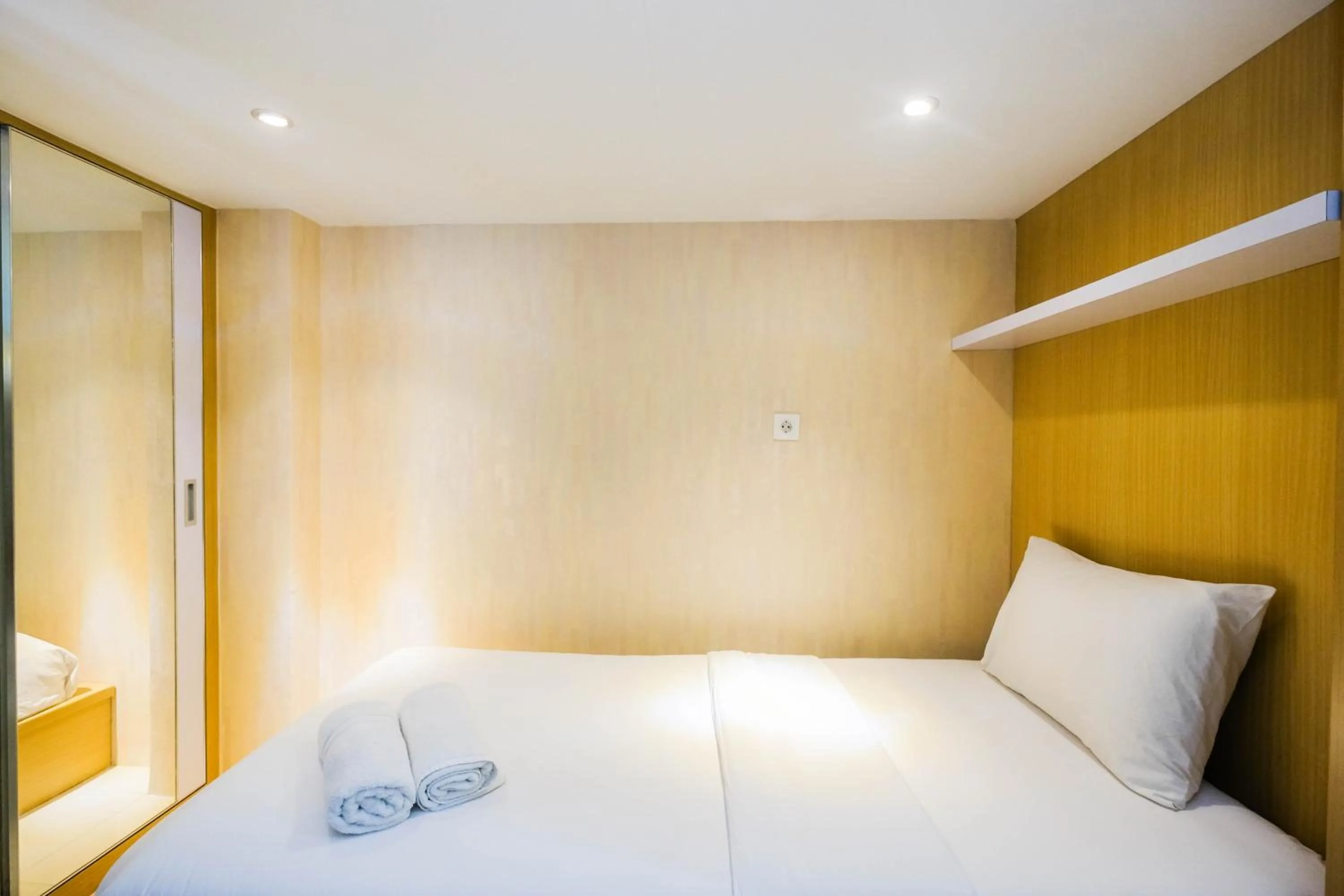 Bed in Fully Furnished Studio with Comfortable Design Dave Apartment By Travelio