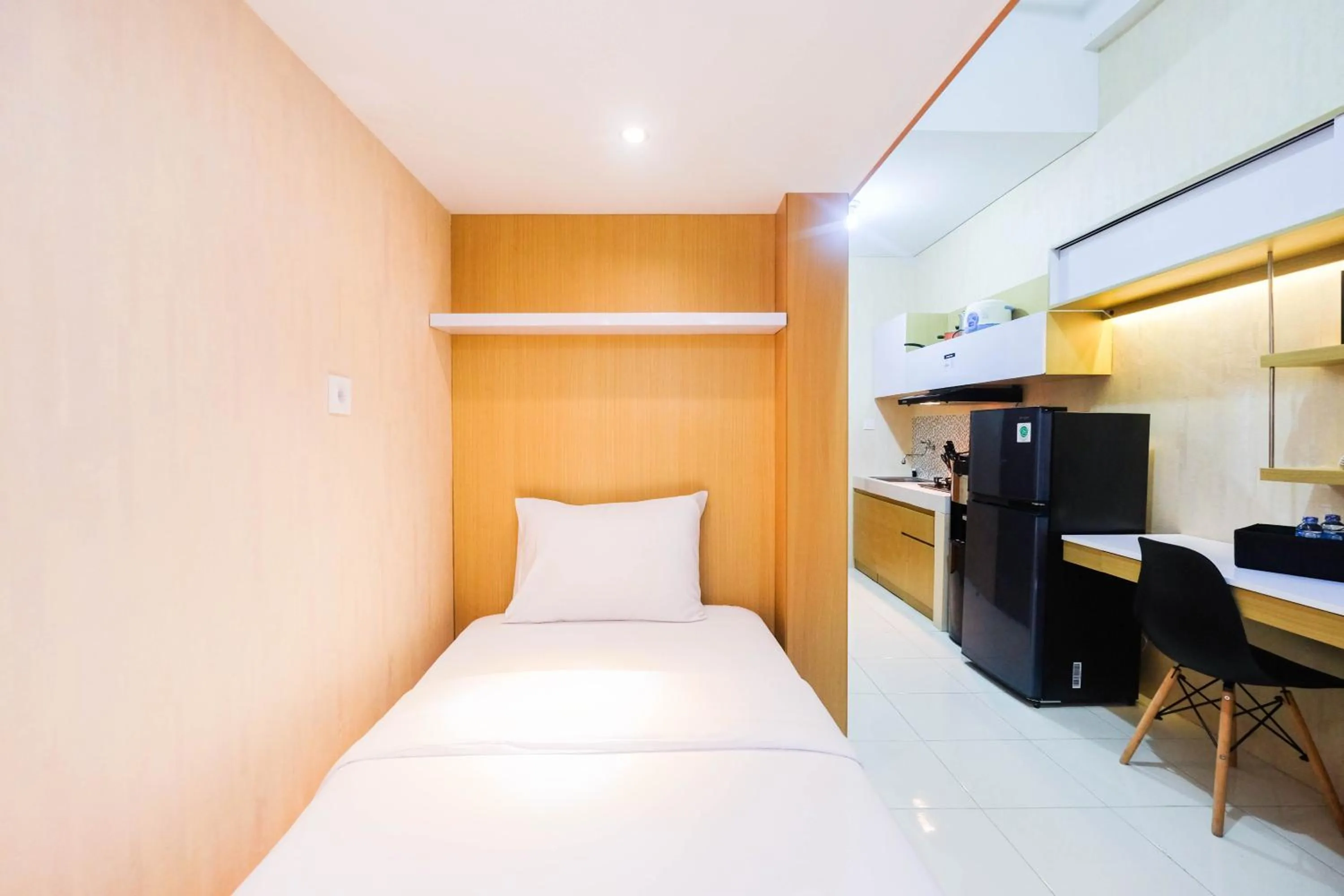 Bed in Fully Furnished Studio with Comfortable Design Dave Apartment By Travelio