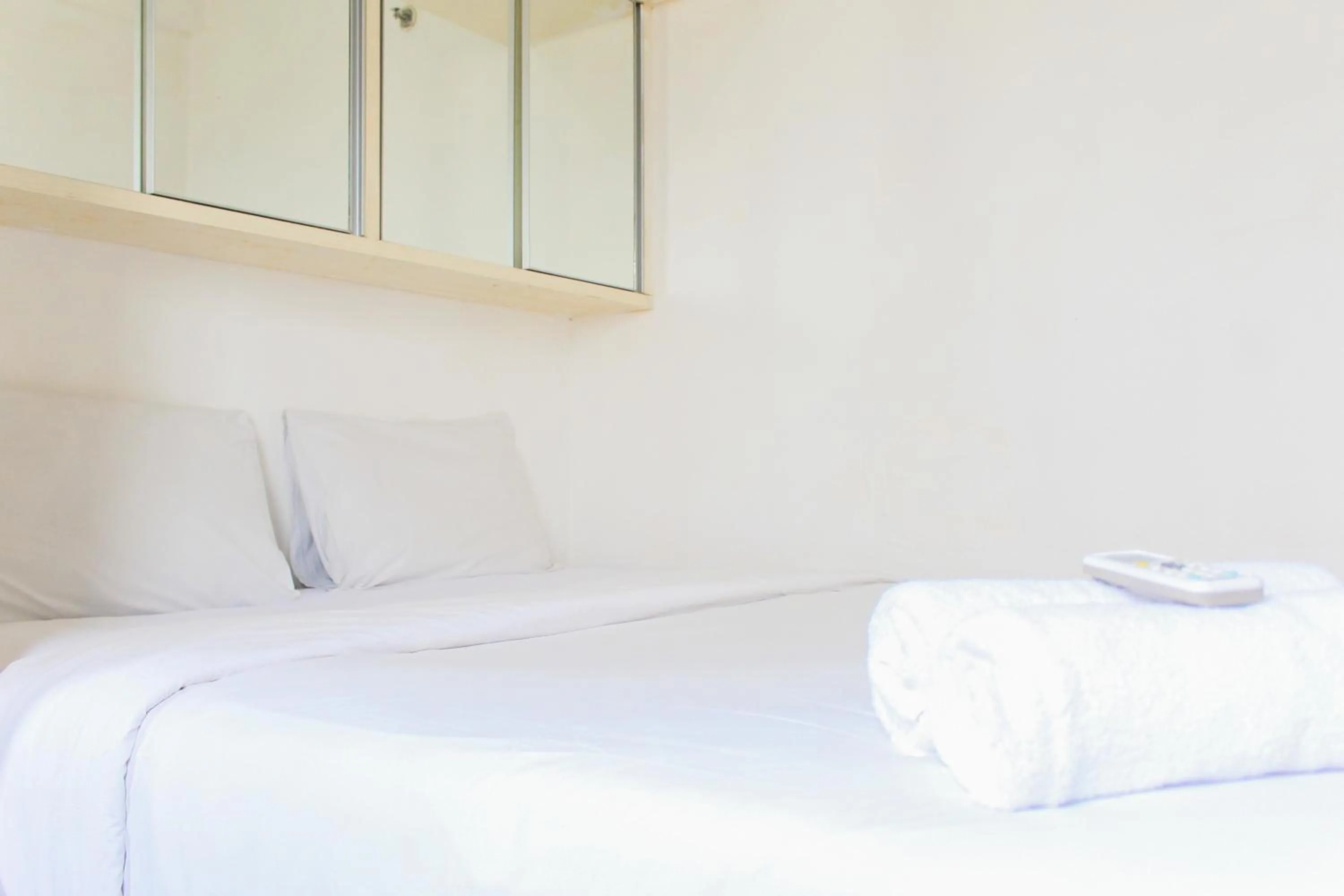 Bed in Best Price 1BR with Extra Room at Menara Latumenten Apartment Grogol By Travelio