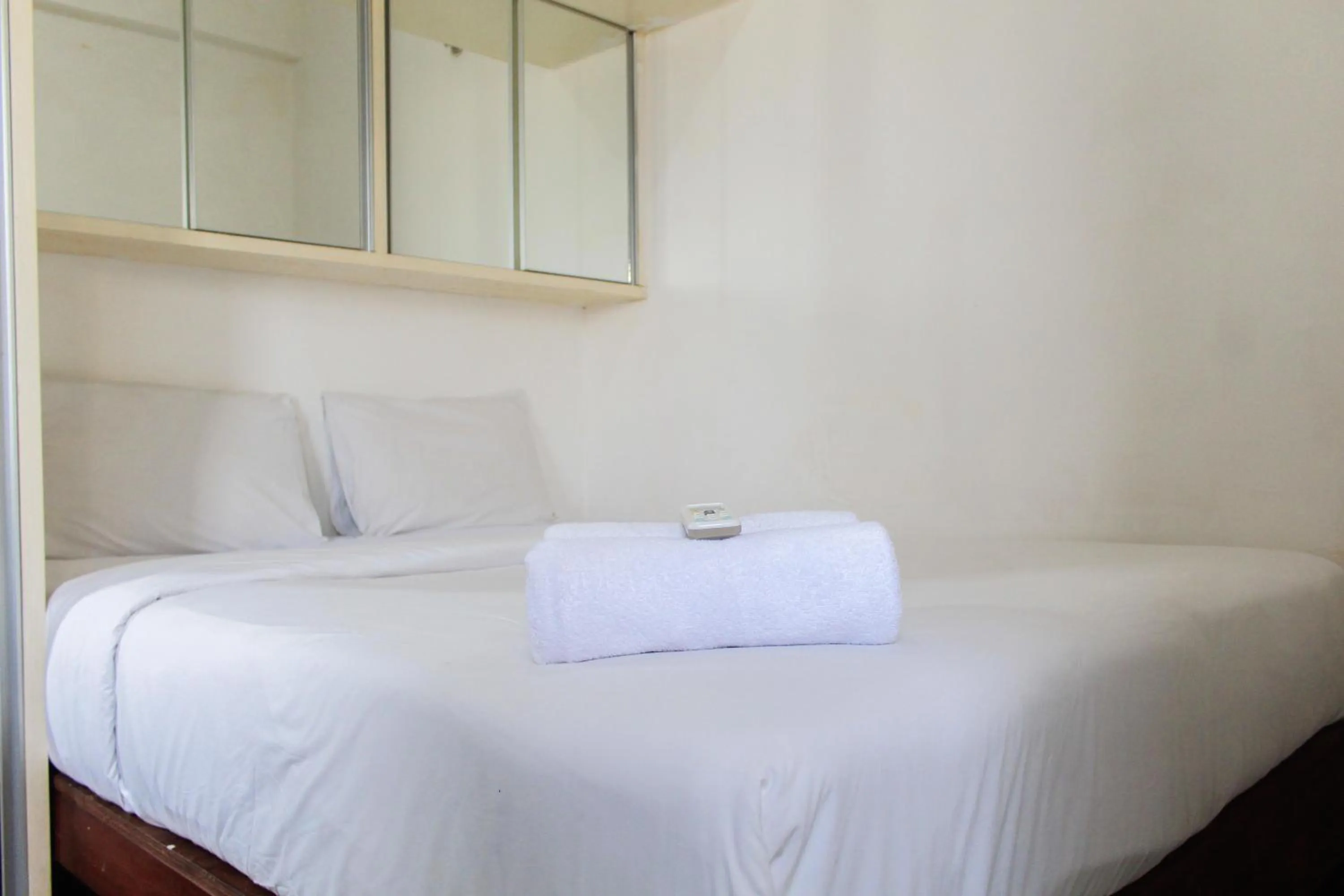 Bed in Best Price 1BR with Extra Room at Menara Latumenten Apartment Grogol By Travelio