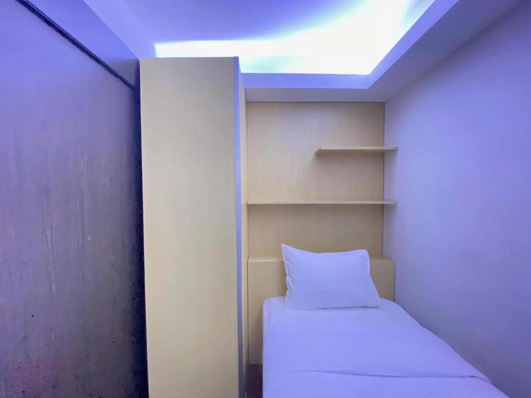 Bed in Quite 2BR Apartment AC in Living Room at The Jarrdin Cihampelas By Travelio