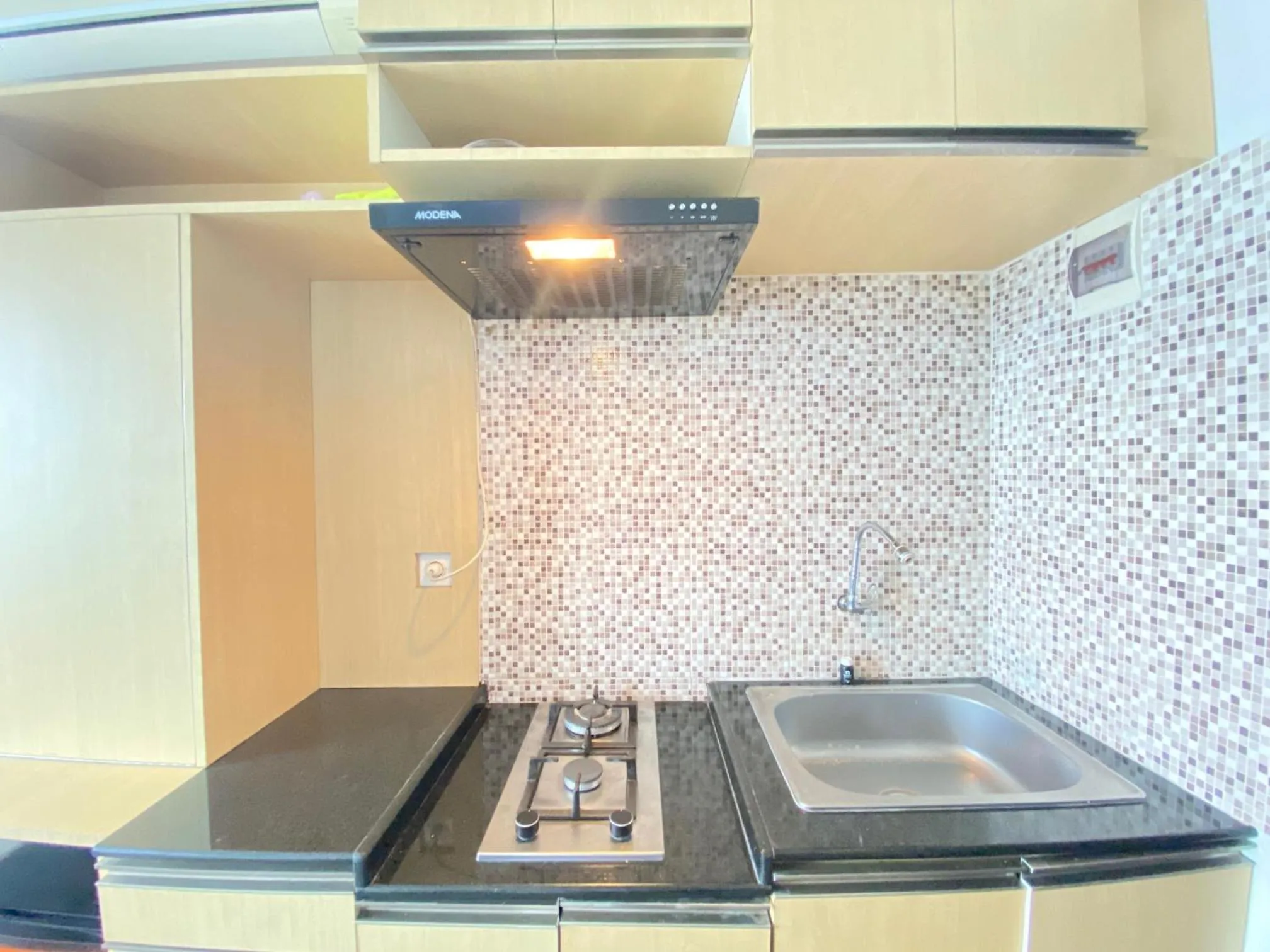 Kitchen or kitchenette in Quite 2BR Apartment AC in Living Room at The Jarrdin Cihampelas By Travelio