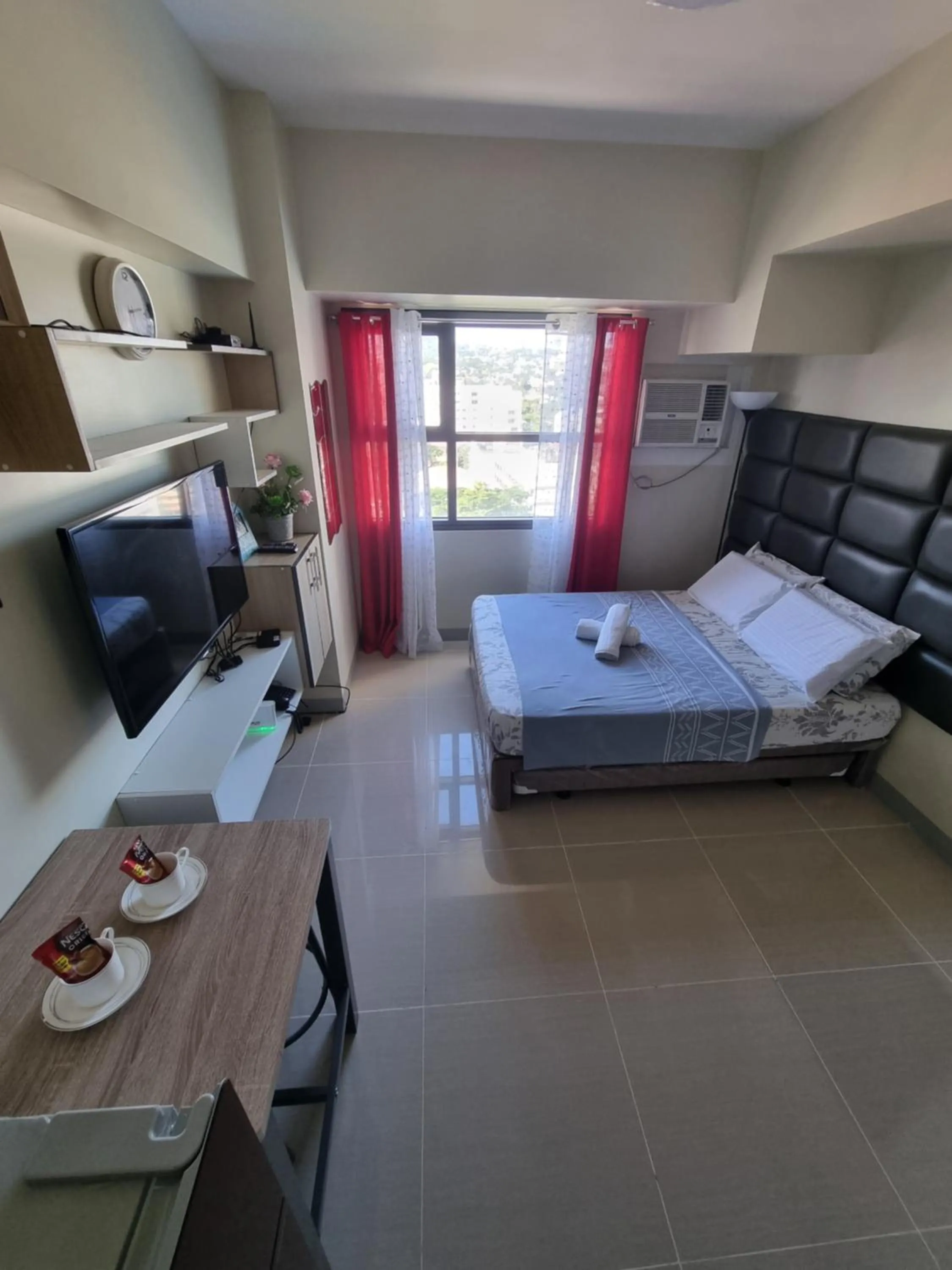 Bed in Studio Condo Unit at Horizons 101