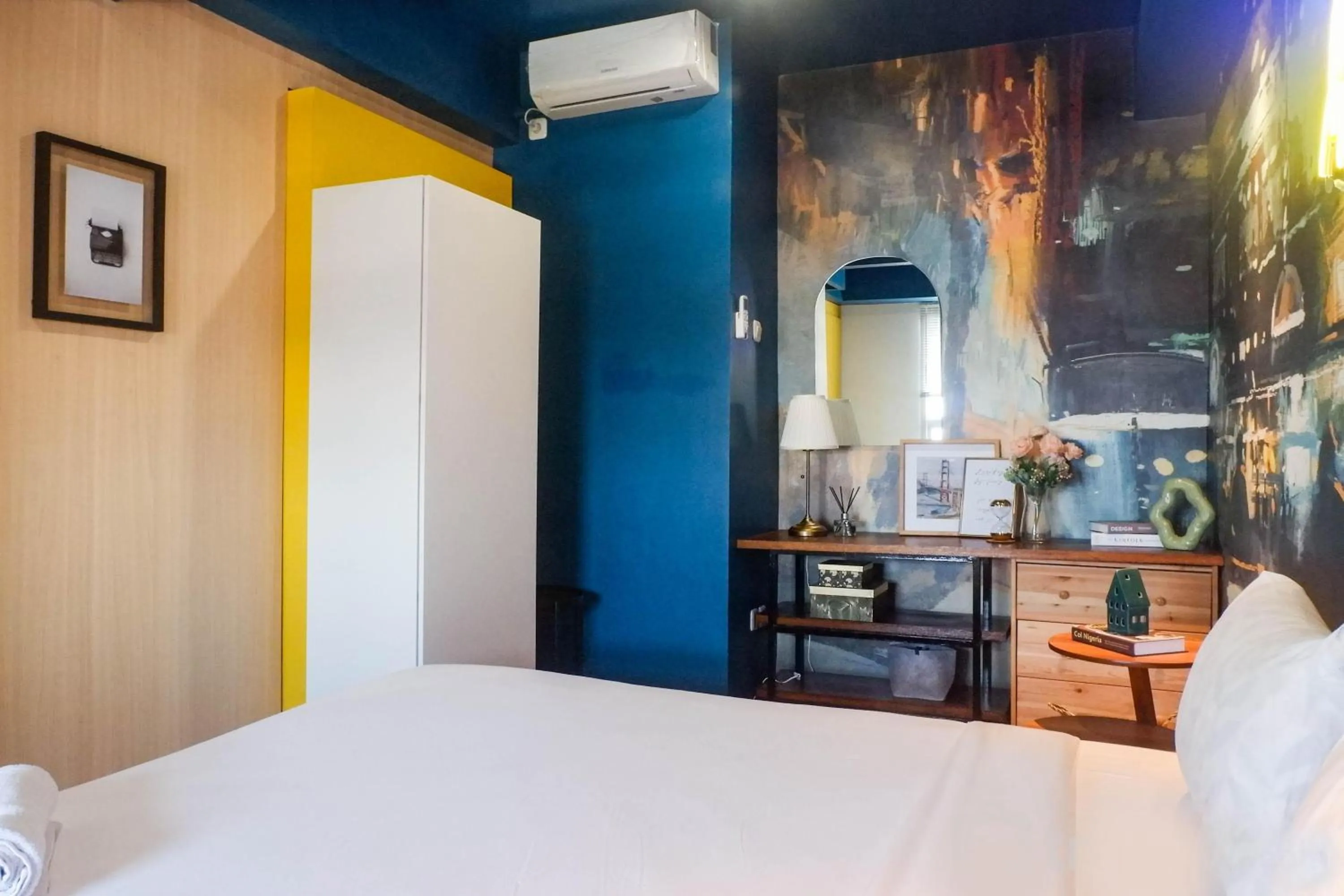 Bed in Exquisite 1BR Apartment at Puri Mas By Travelio