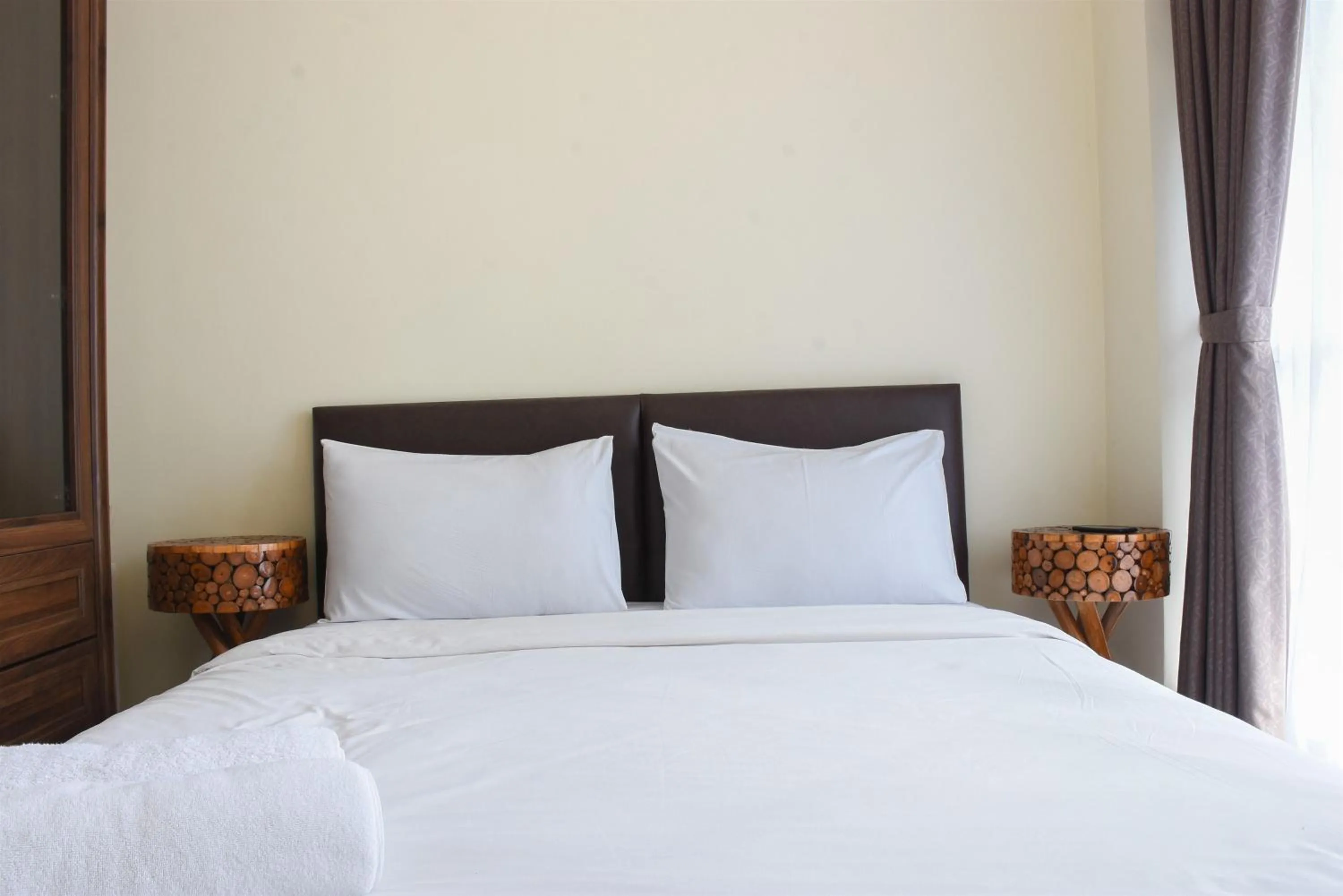 One-Bedroom Apartment in Nice and Cozy Studio at Tifolia Apartment By Travelio