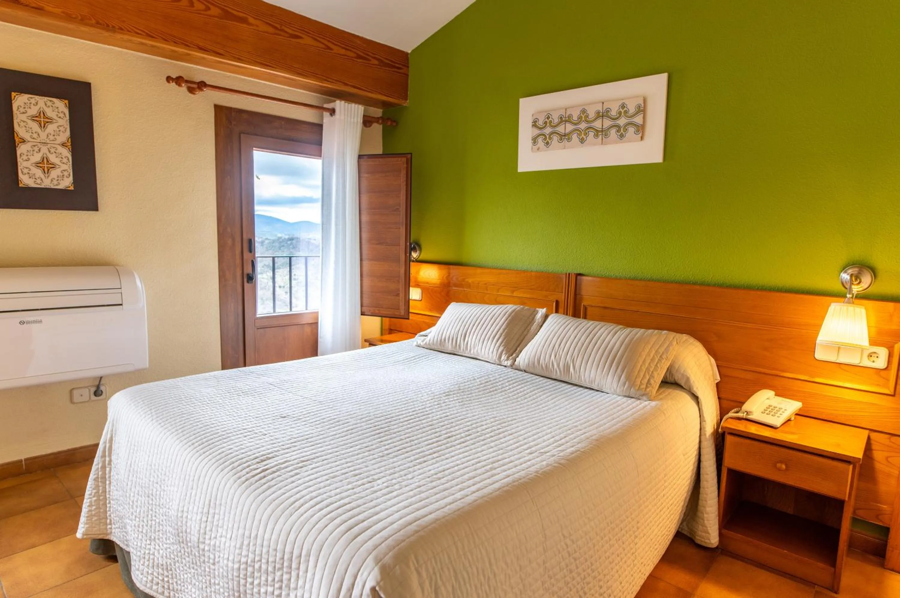 Bed in Hotel Rey Don Jaime