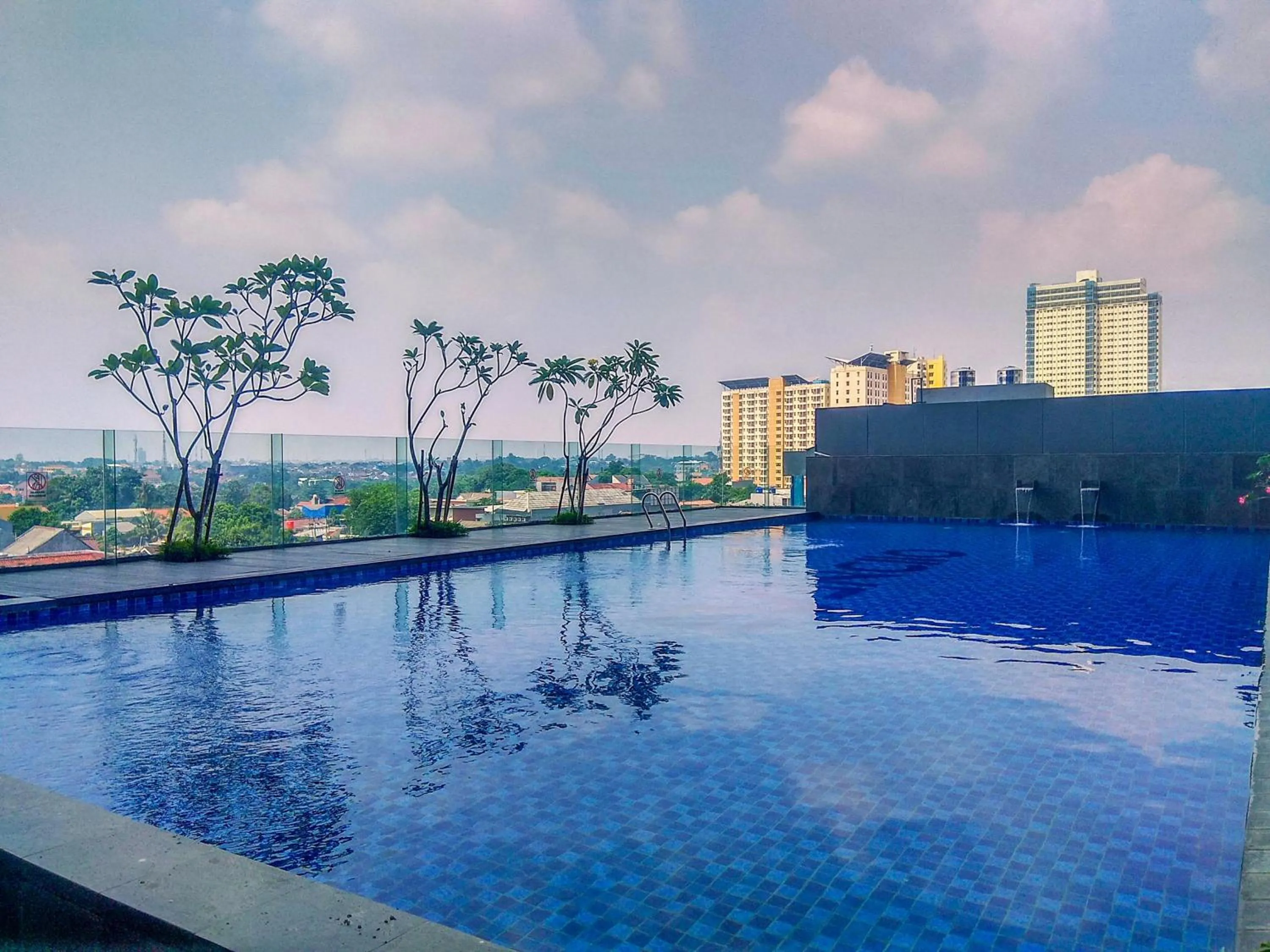 Swimming pool in Pleasurable Studio at Evenciio Apartment near Campus Area By Travelio