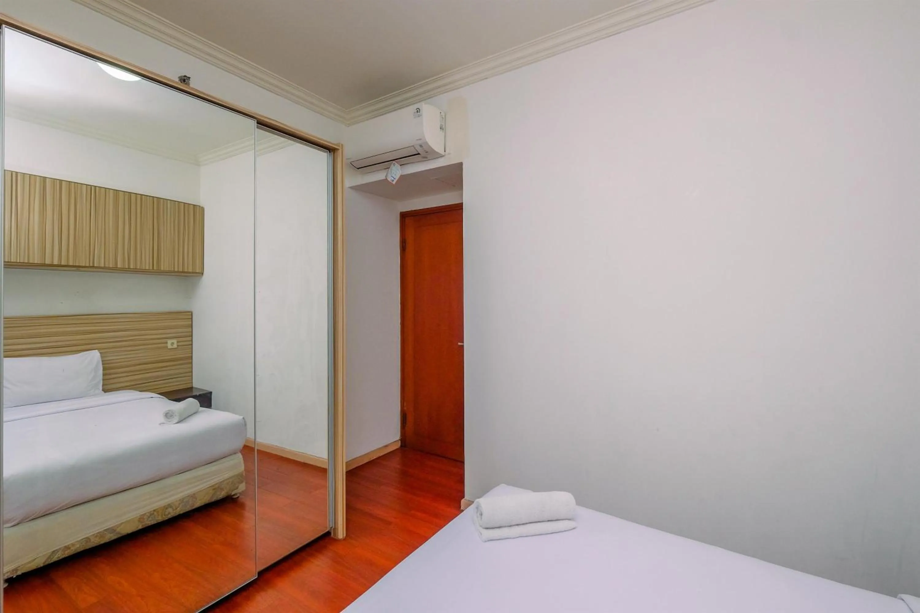 Bed in Comfort 2BR + Extra Room at Sudirman Tower Condominium Apartment By Travelio