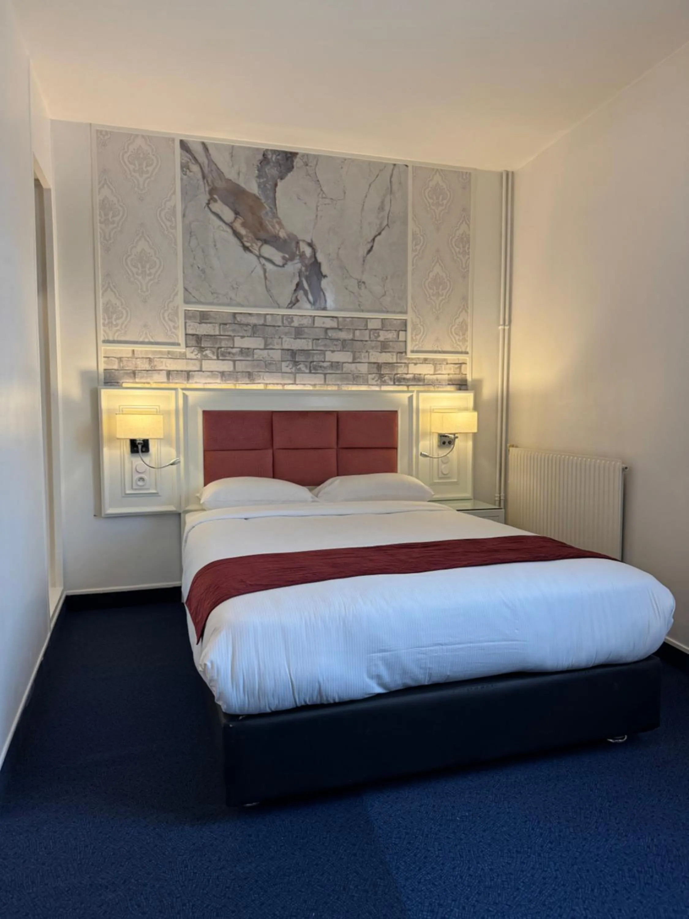 Bed in Hotel Grand Paris