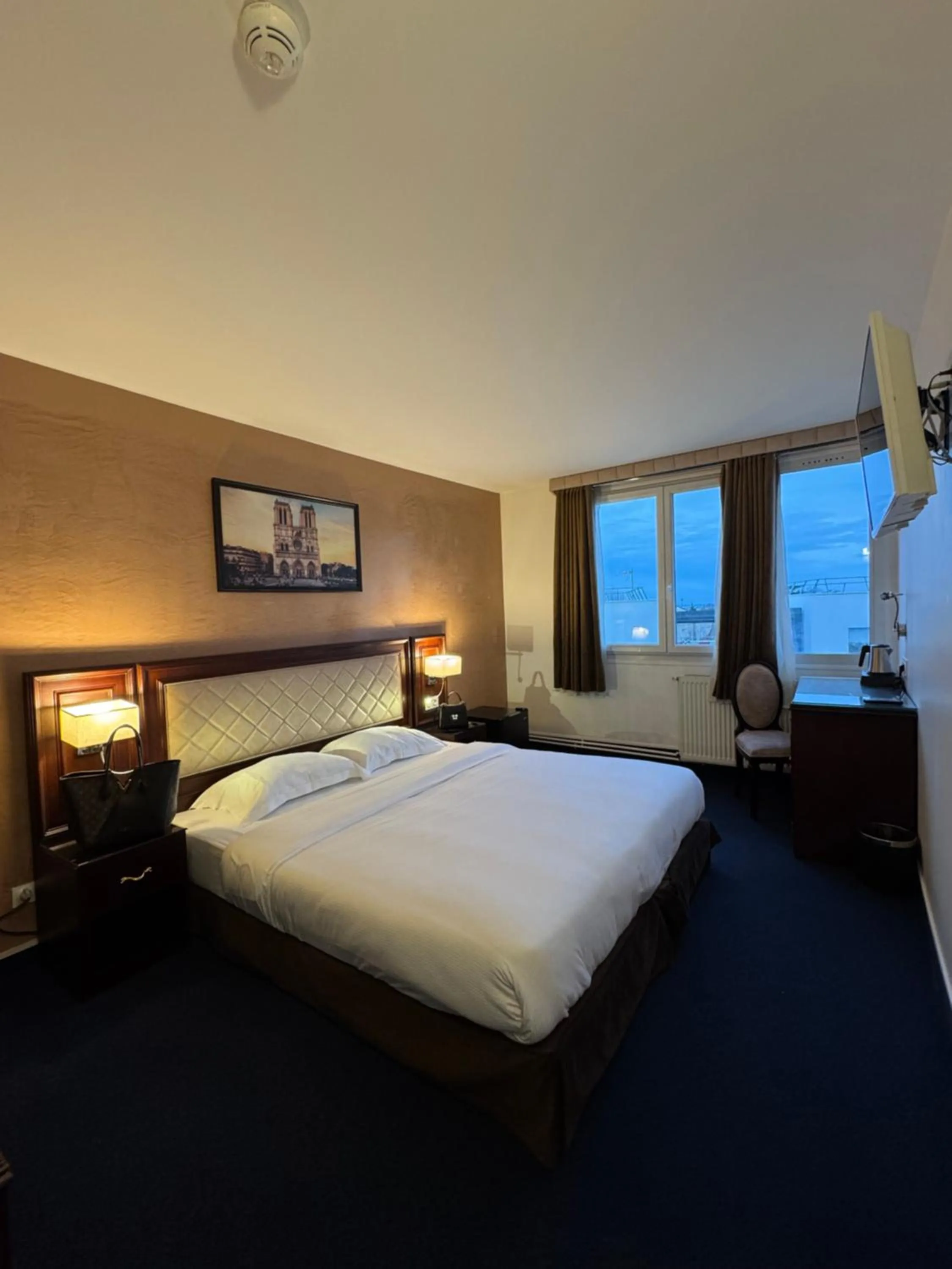 Bed in Hotel Grand Paris