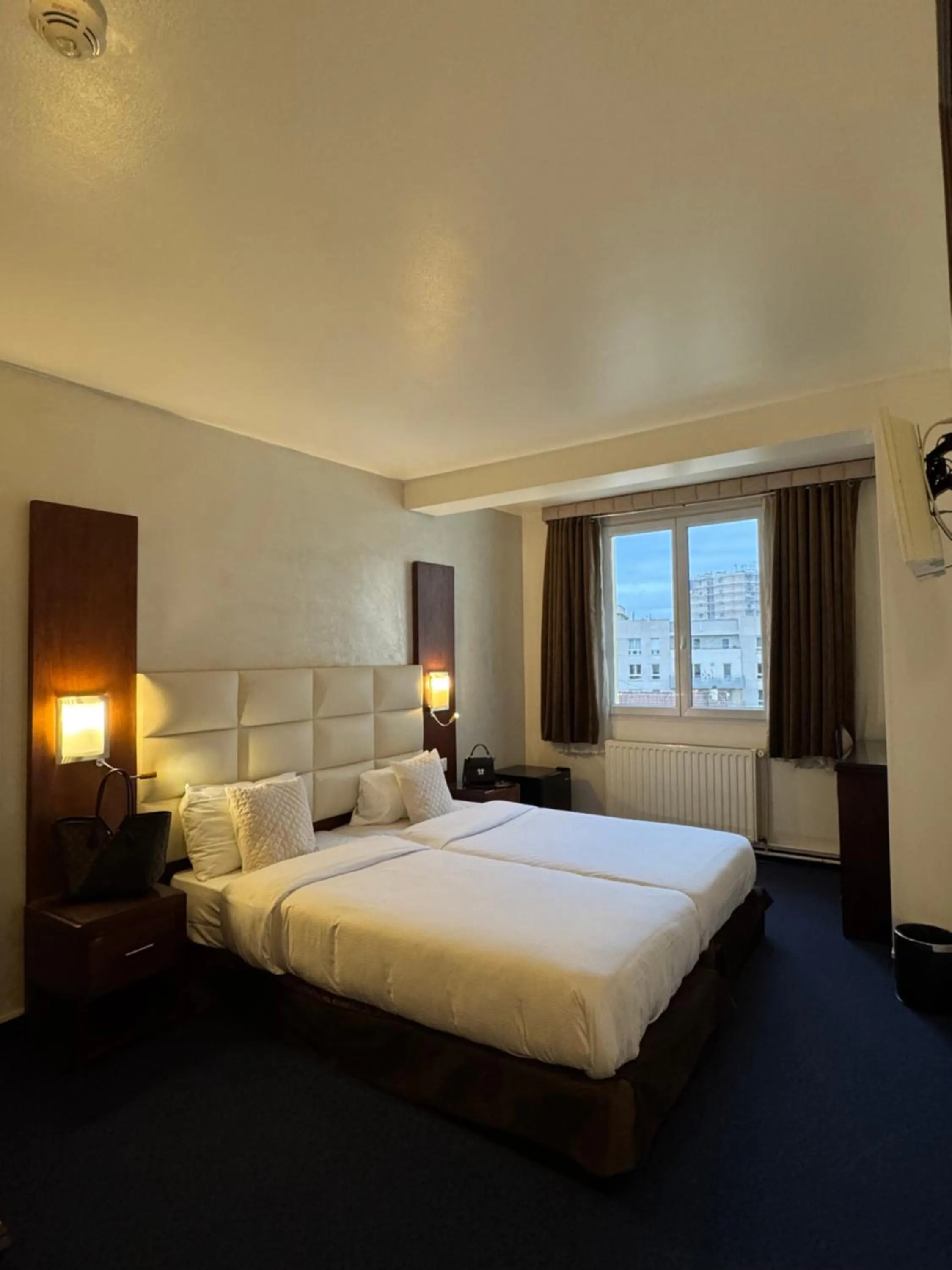 Bed in Hotel Grand Paris