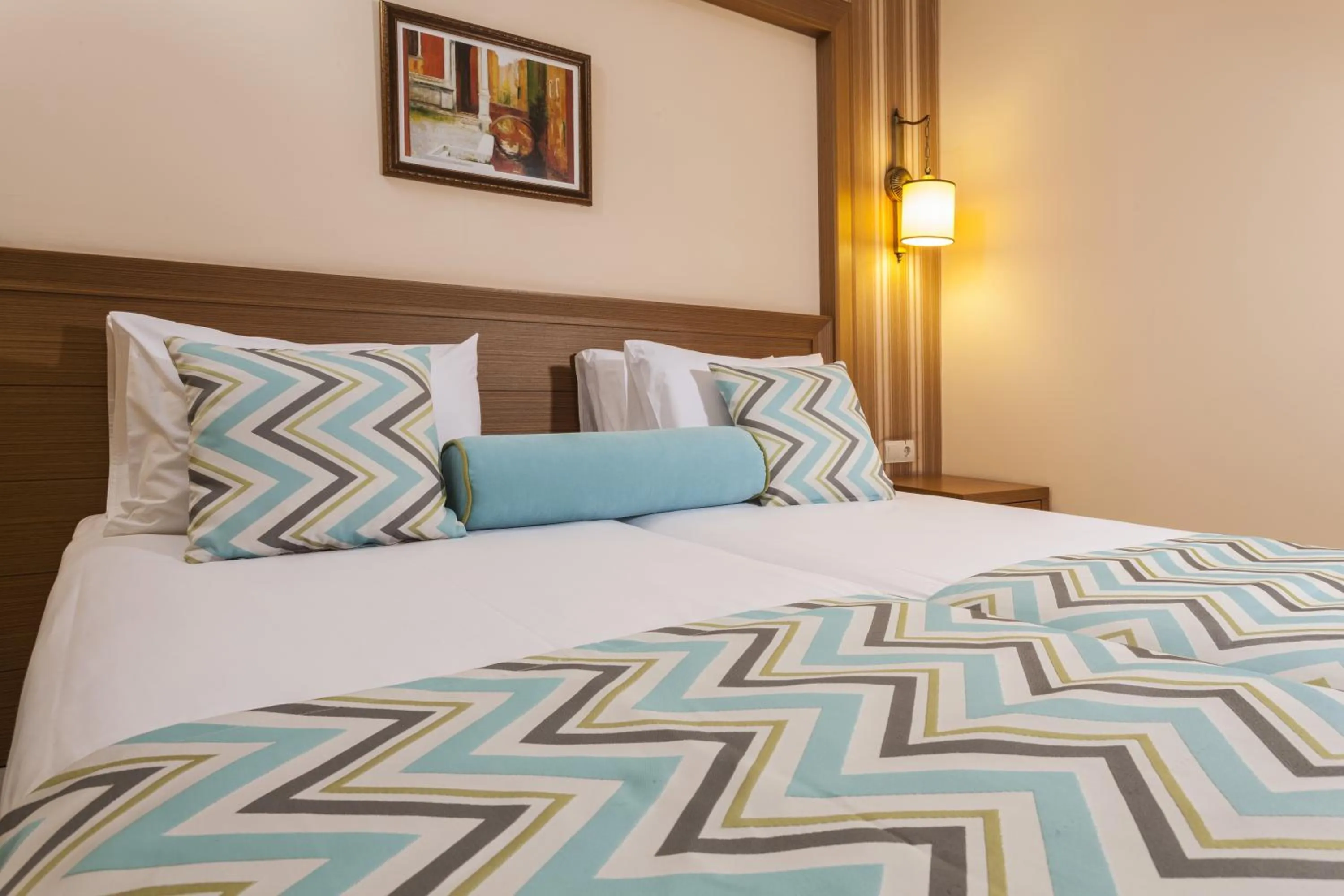 Bed in Iz Flower Side Beach Hotel