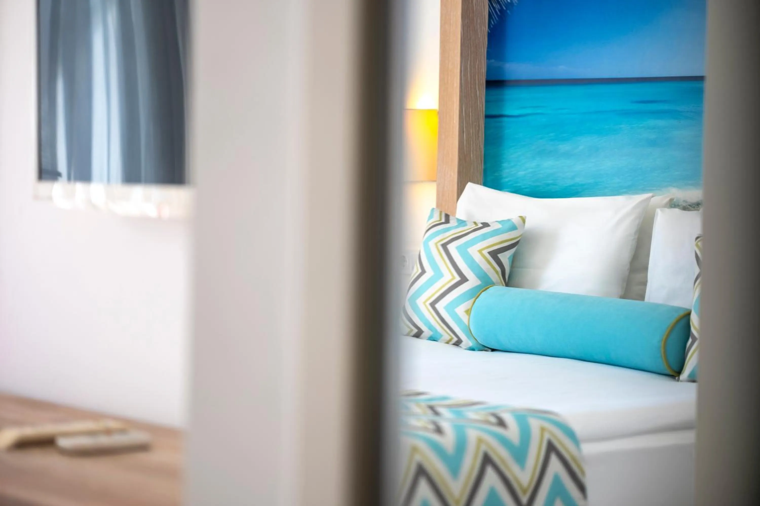 Bed in Iz Flower Side Beach Hotel