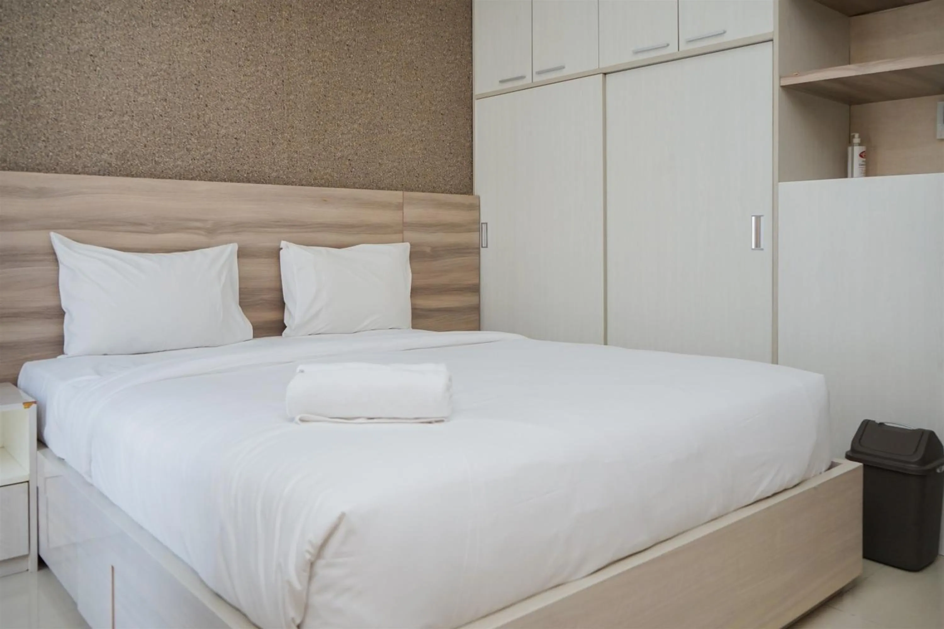 Bed in Cozy Stay Studio at Paramount Skyline Apartment By Travelio