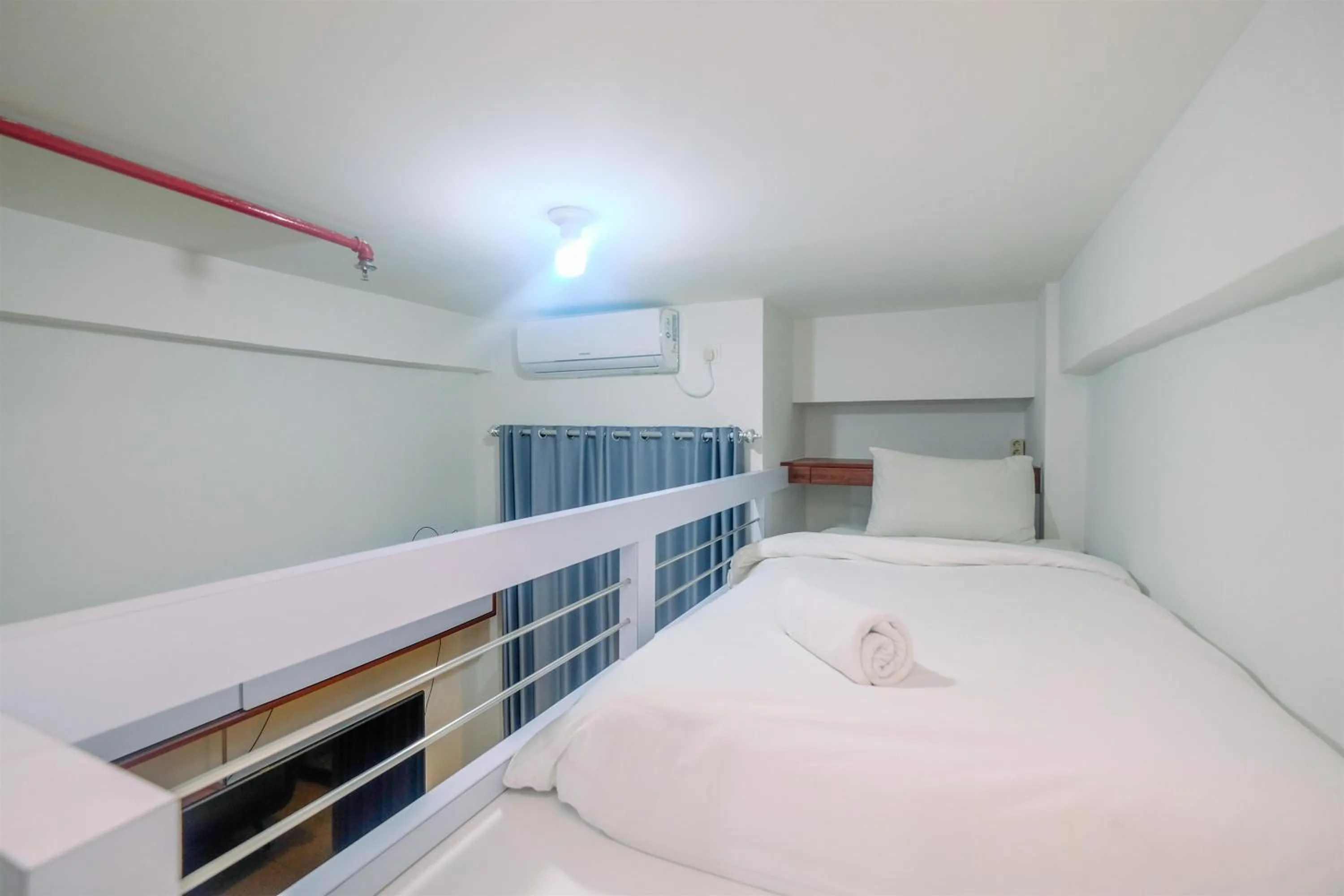 Bed in Homey and Comfort Living Studio Room at Dave Apartment By Travelio