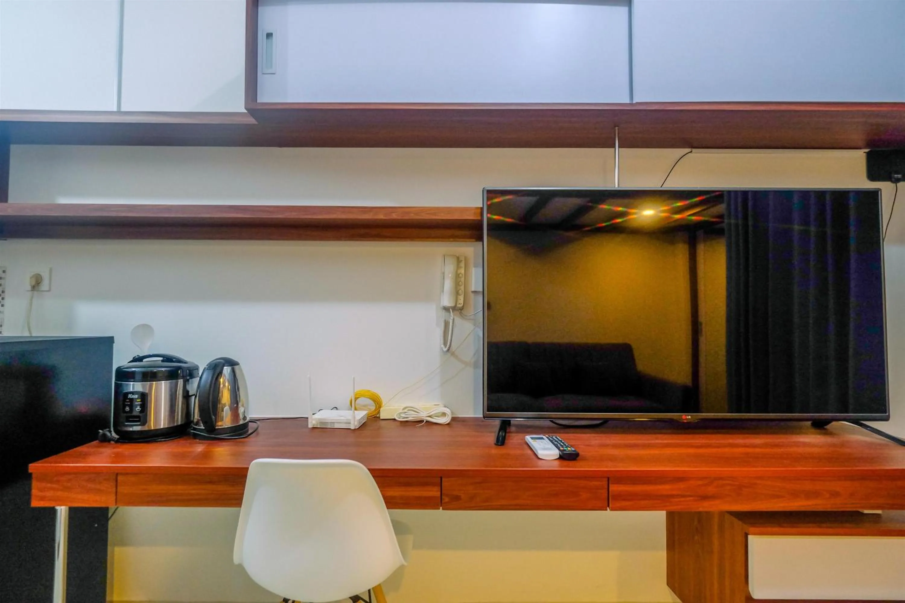 Bedroom in Homey and Comfort Living Studio Room at Dave Apartment By Travelio