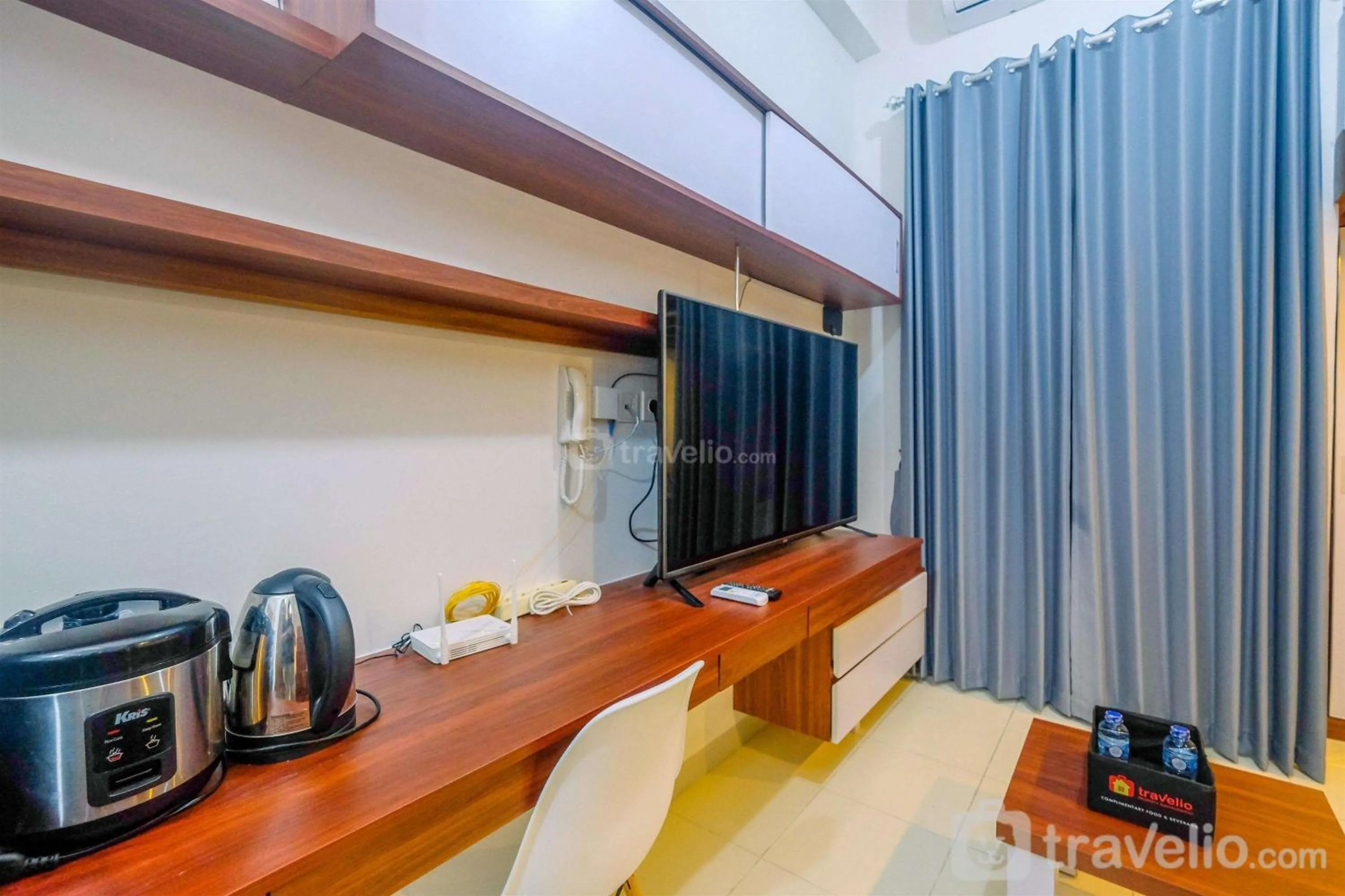 Bed in Homey and Comfort Living Studio Room at Dave Apartment By Travelio
