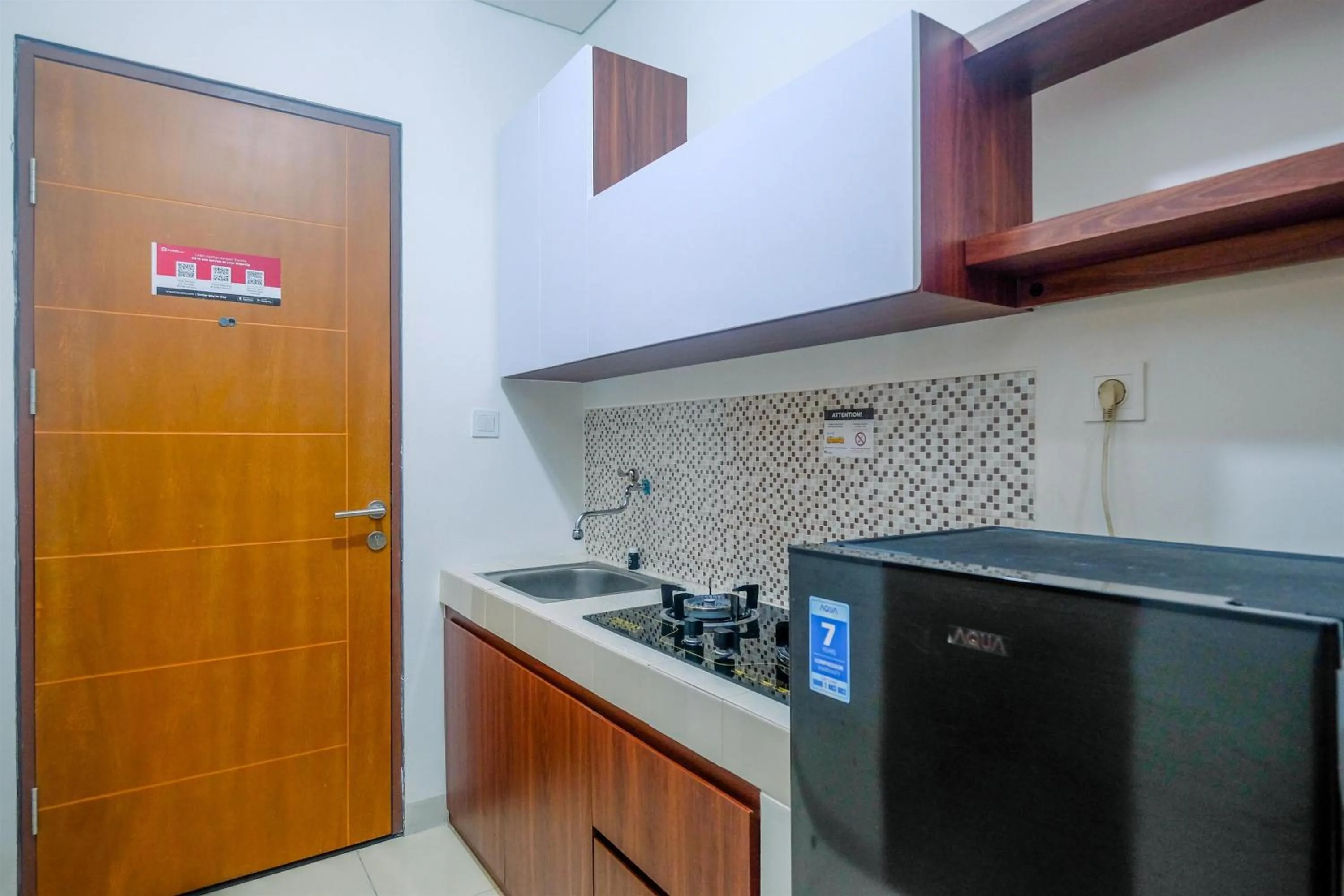 Kitchen or kitchenette in Homey and Comfort Living Studio Room at Dave Apartment By Travelio