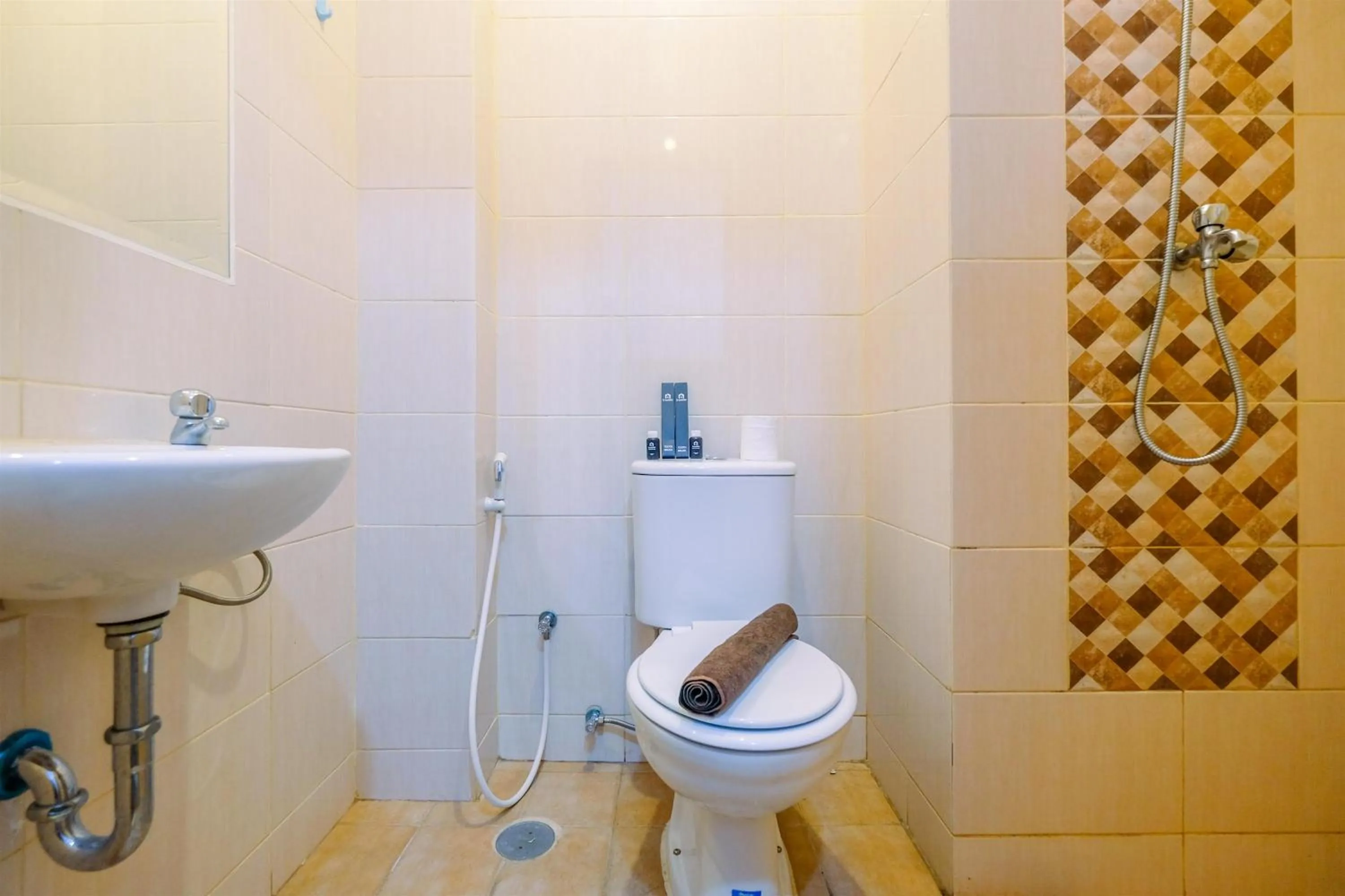 Bathroom in Homey and Comfort Living Studio Room at Dave Apartment By Travelio