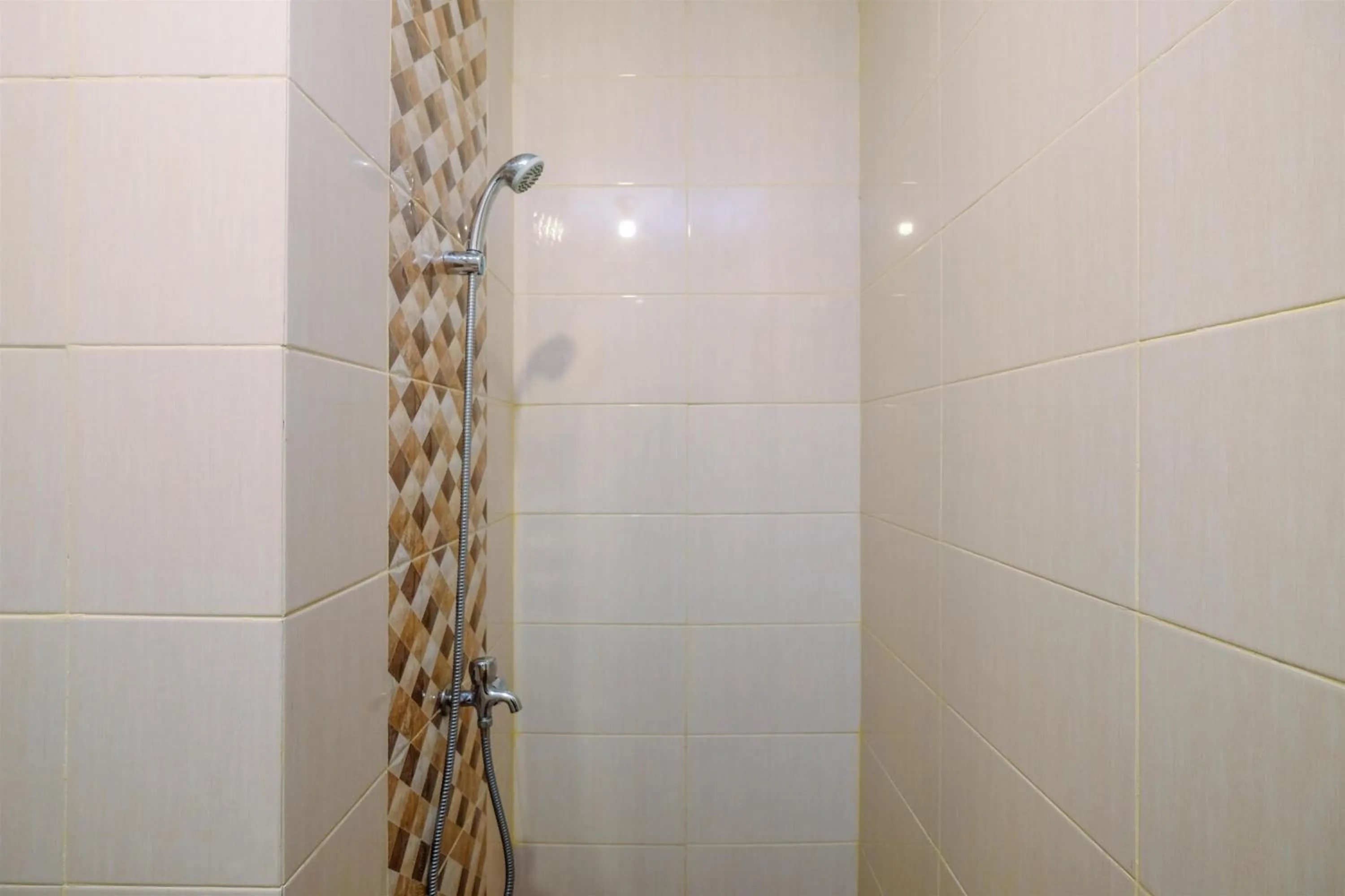 Bathroom in Homey and Comfort Living Studio Room at Dave Apartment By Travelio