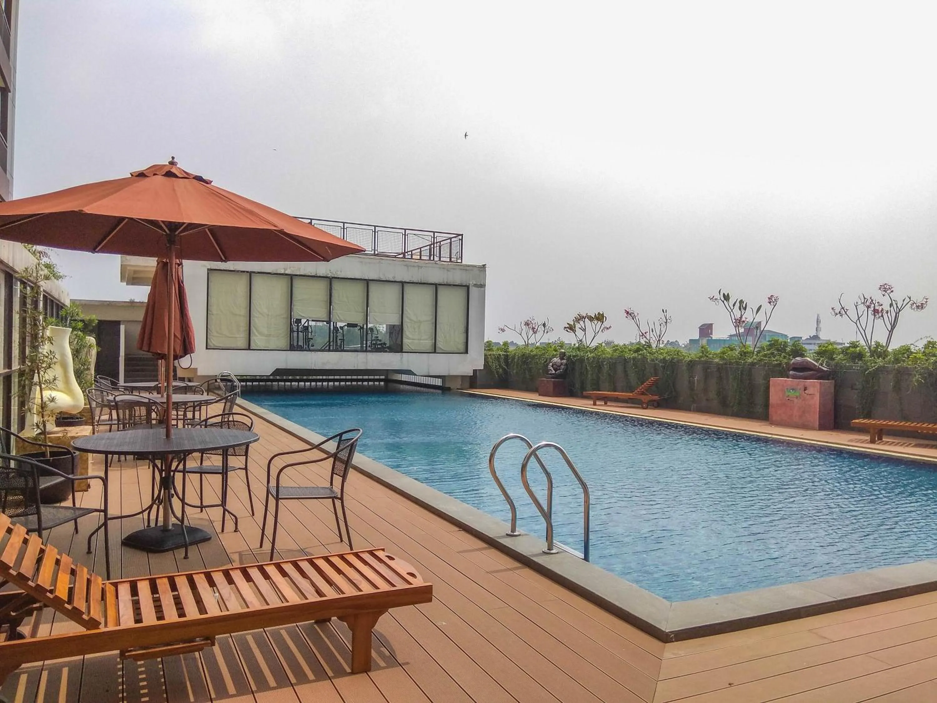 Swimming pool in Comfy and Tidy Studio at Dave Apartment By Travelio