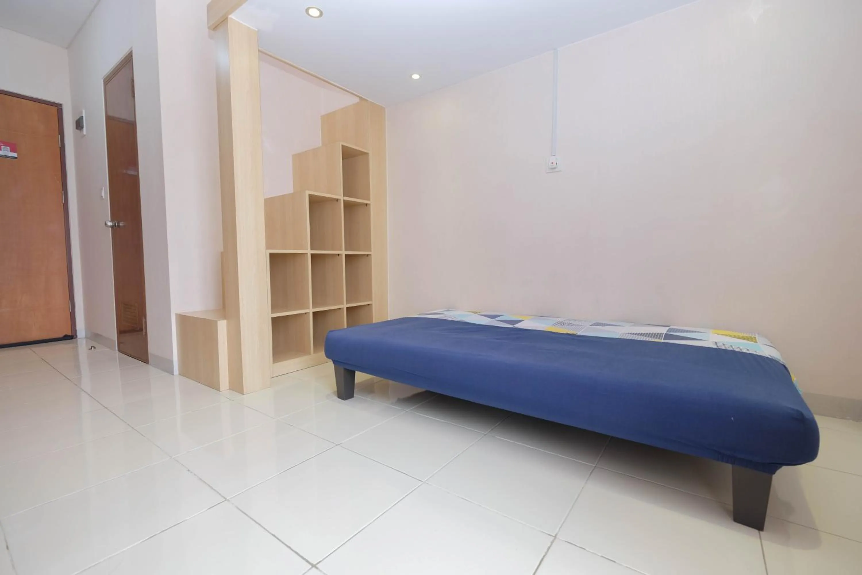 Bed in Comfy and Tidy Studio at Dave Apartment By Travelio