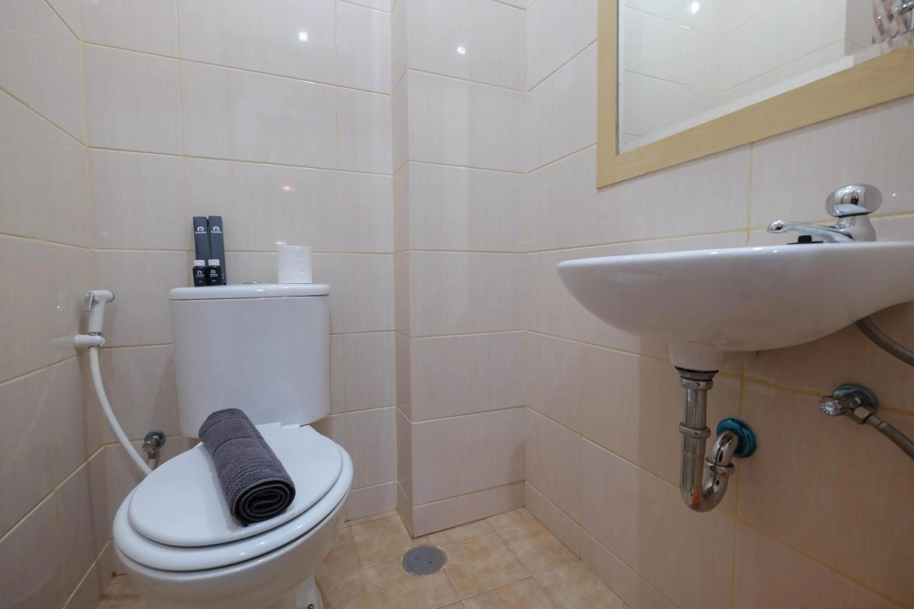 Bathroom in Comfy and Tidy Studio at Dave Apartment By Travelio