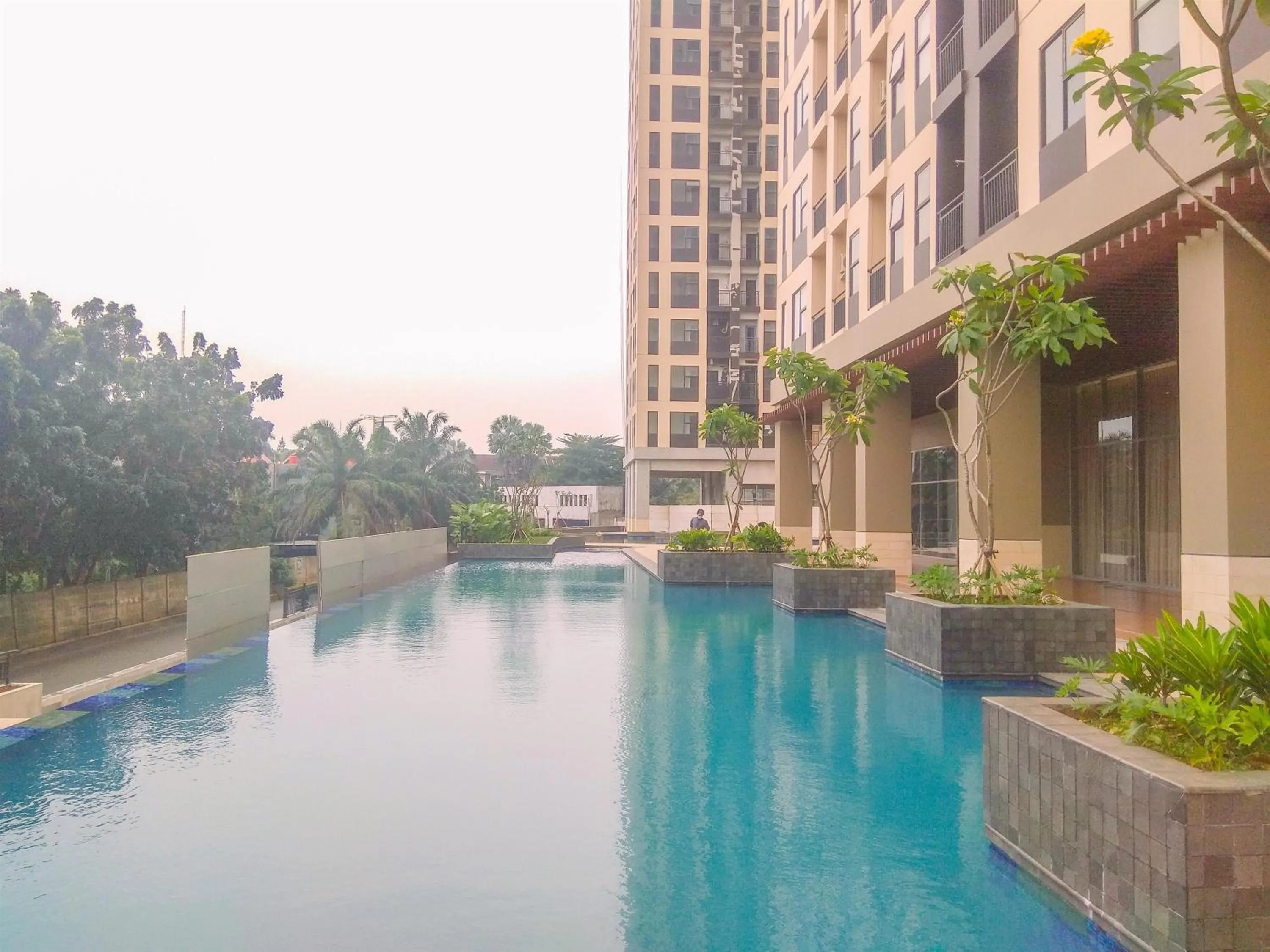 Swimming pool in Cozy Studio at Transpark Cibubur Apartment By Travelio