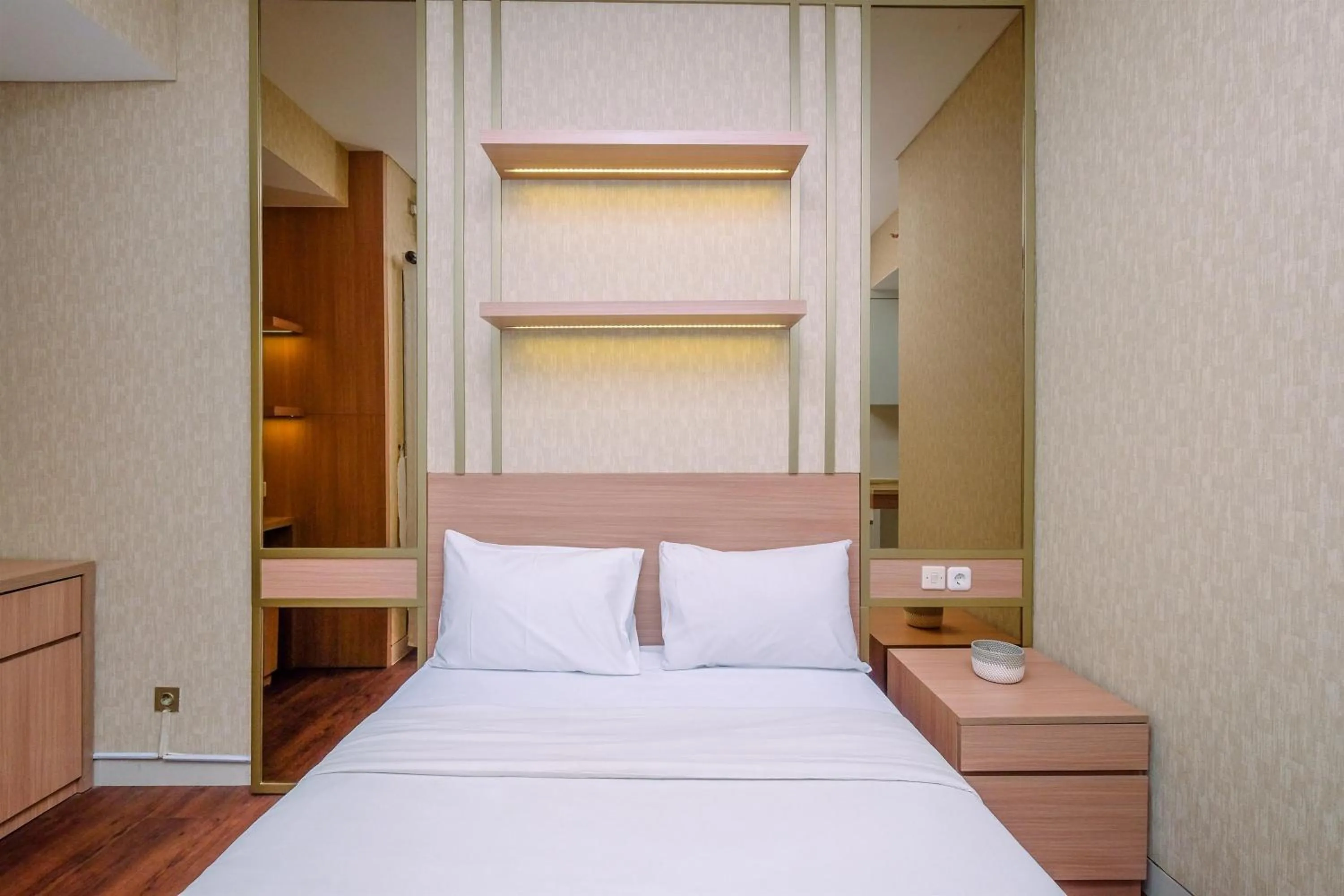 Bed in Cozy Studio at Transpark Cibubur Apartment By Travelio