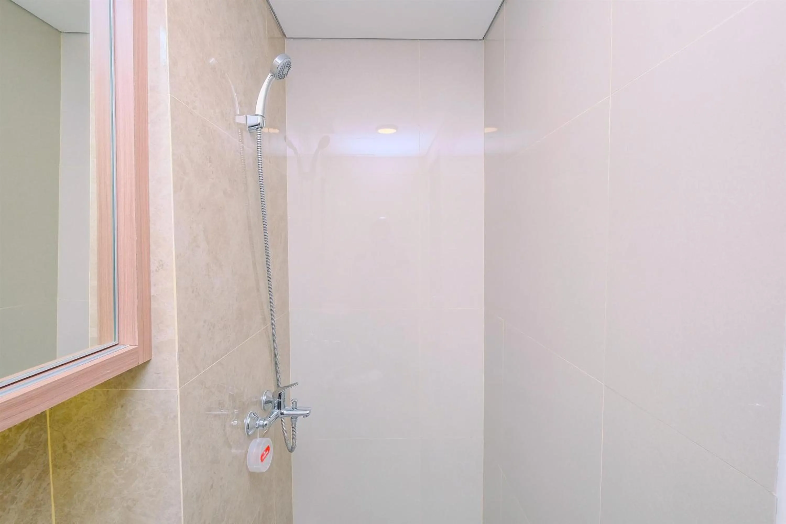 Bathroom in Cozy Studio at Transpark Cibubur Apartment By Travelio