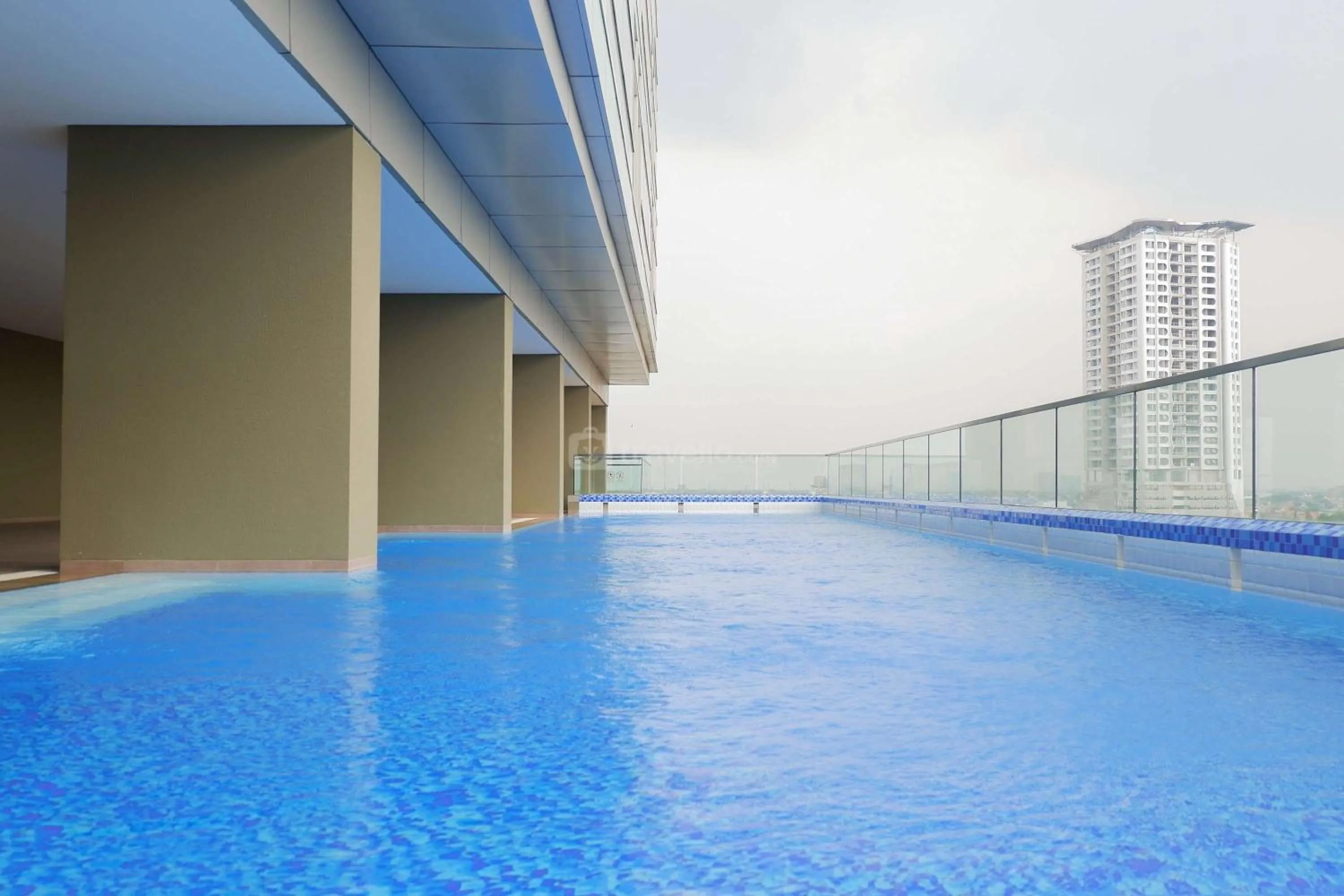 Swimming pool in 1BR Stunning and Cozy Apartment at Praxis By Travelio