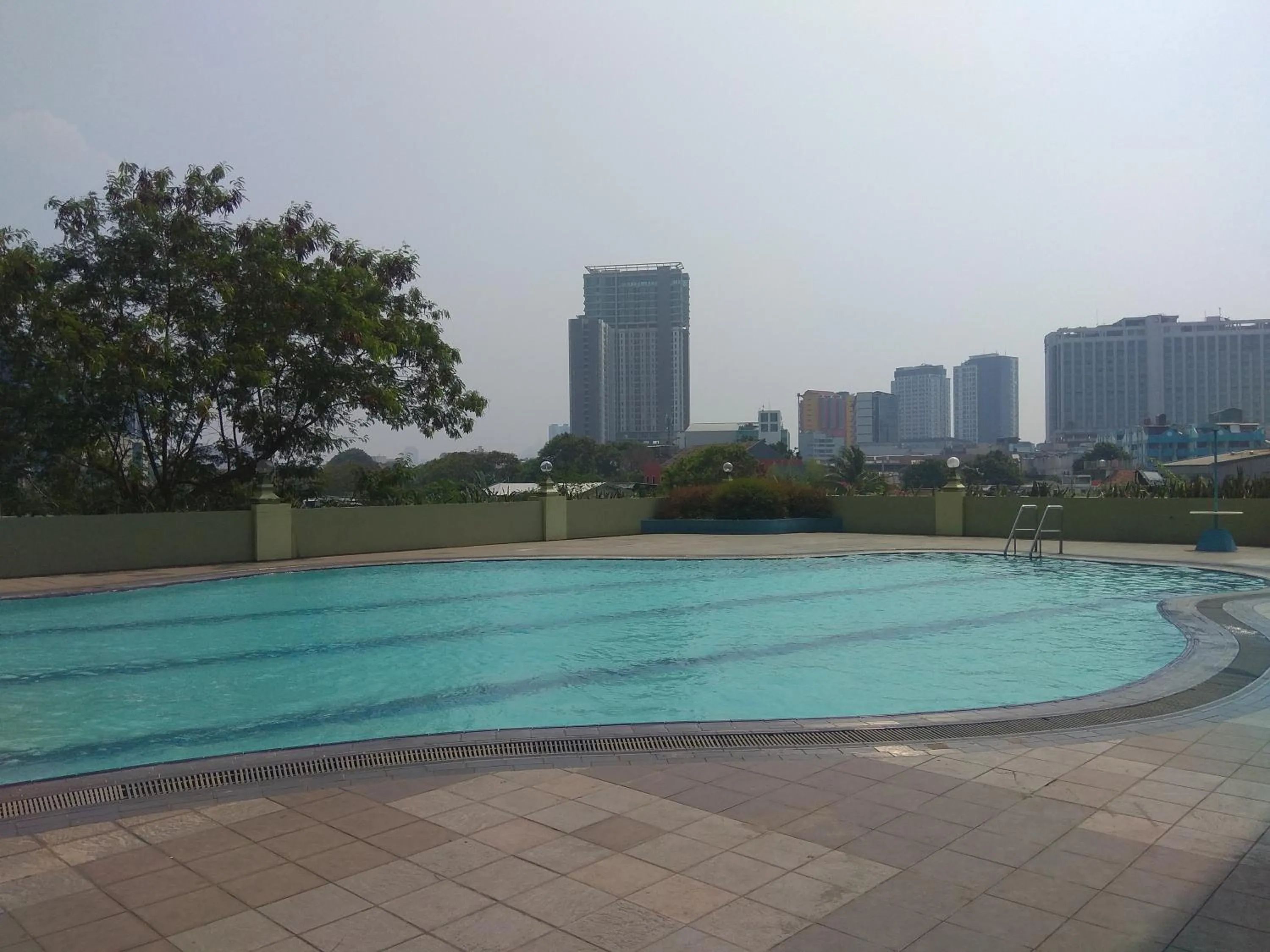 Property building in Spacious and Homey 3BR at Kondominium Rajawali Apartment By Travelio