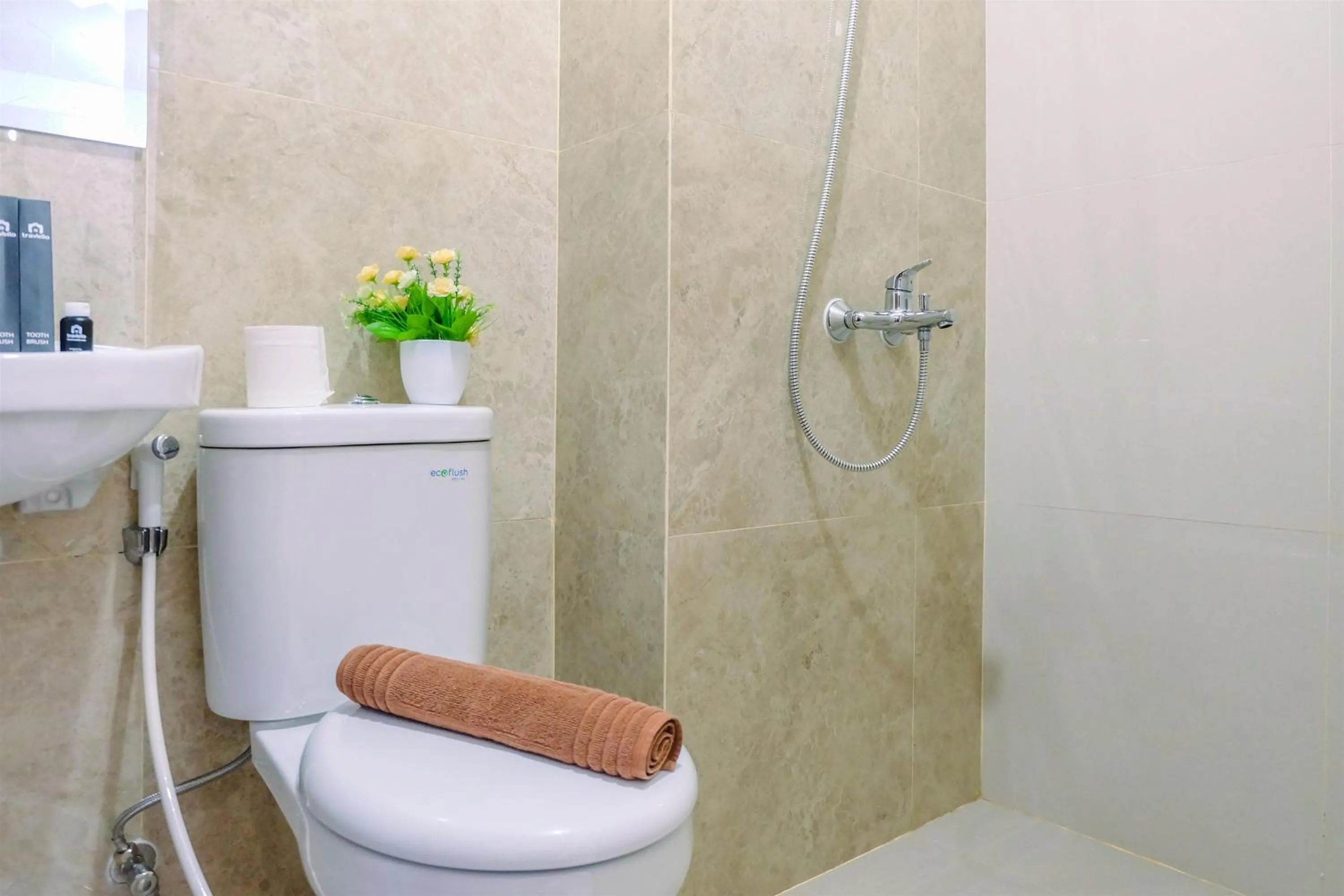 Bathroom in Simply and Homey Studio Transpark Cibubur Apartment By Travelio