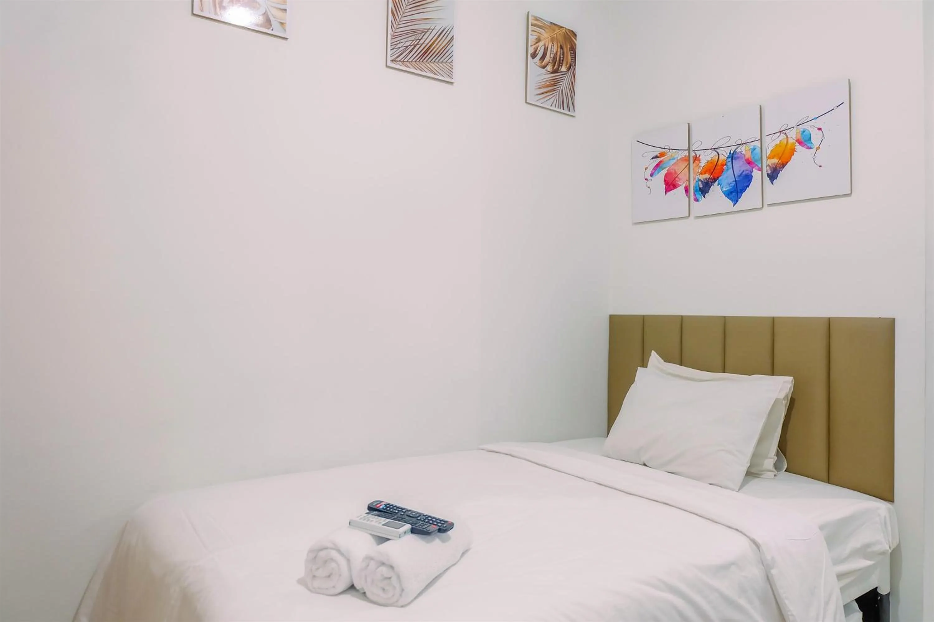 Bed in Simply and Homey Studio Transpark Cibubur Apartment By Travelio