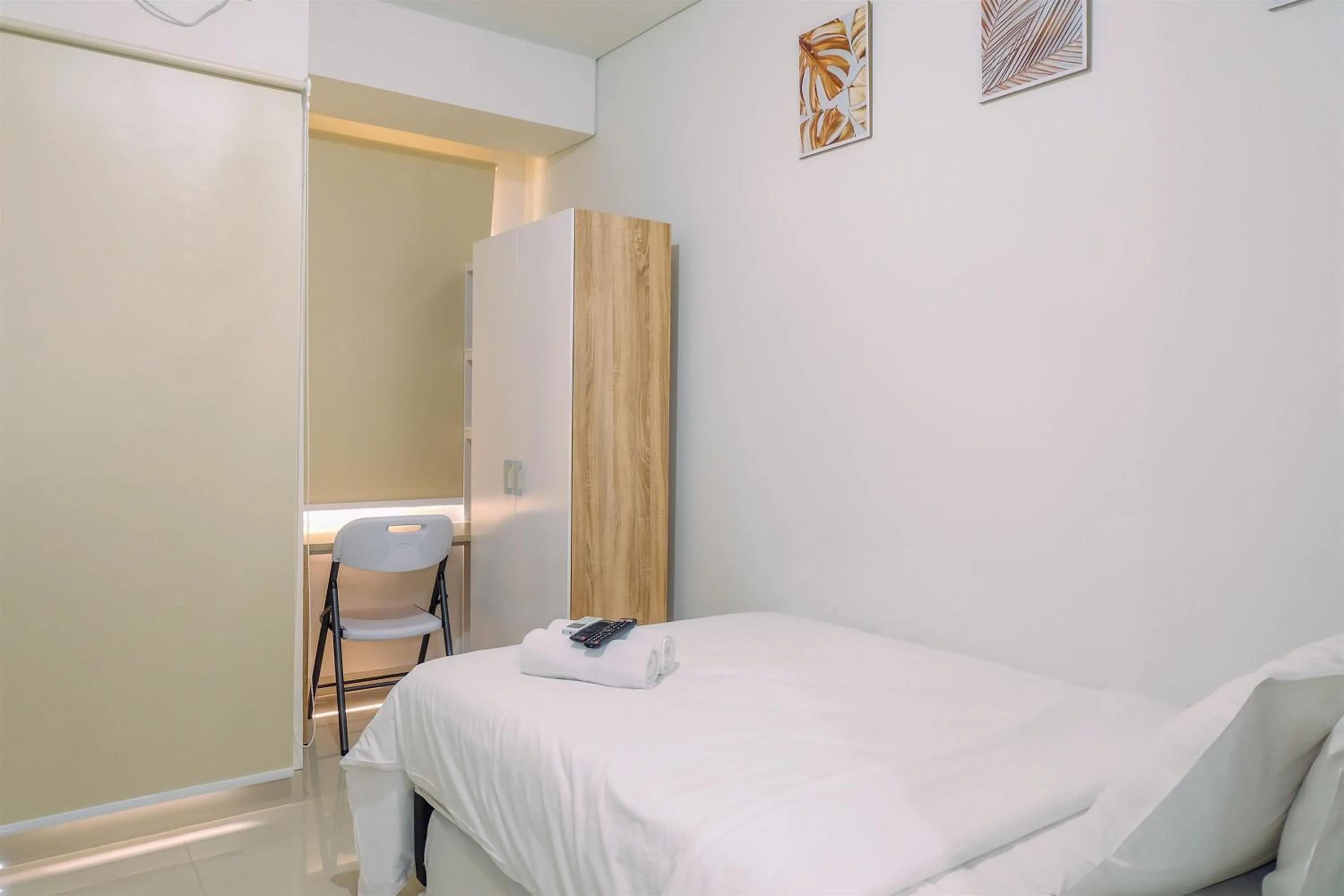 Bed in Simply and Homey Studio Transpark Cibubur Apartment By Travelio
